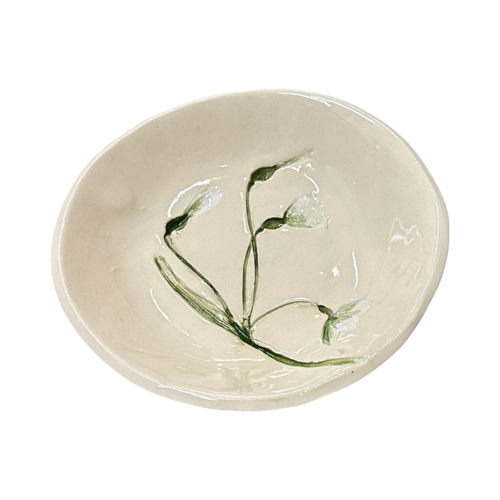 Ceramic dish with floral design on a white background.