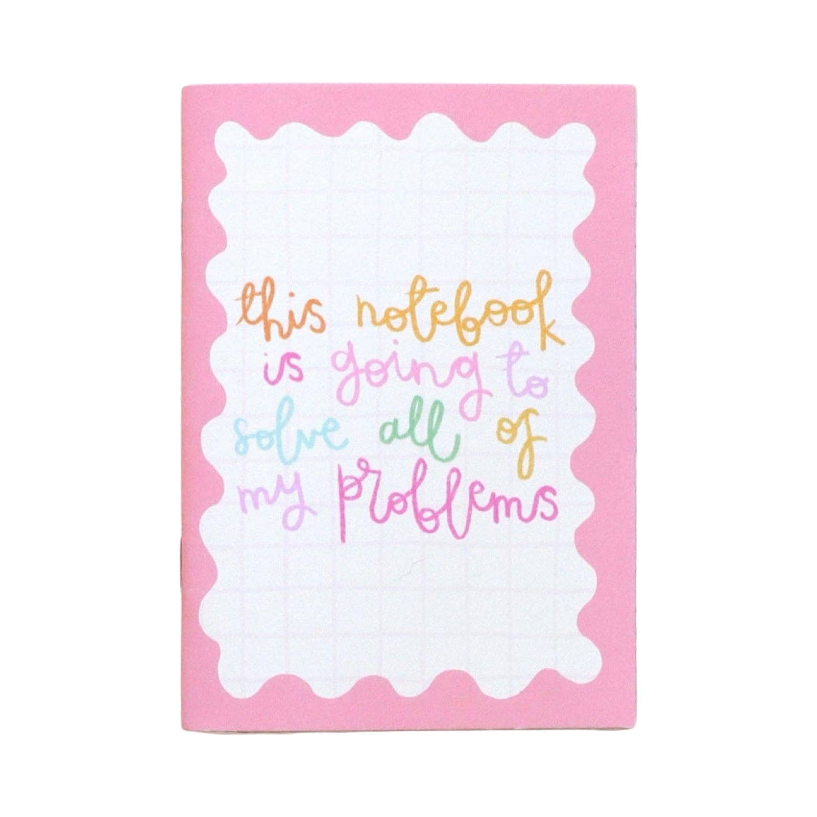 Notebook with colourful text on a pink background.