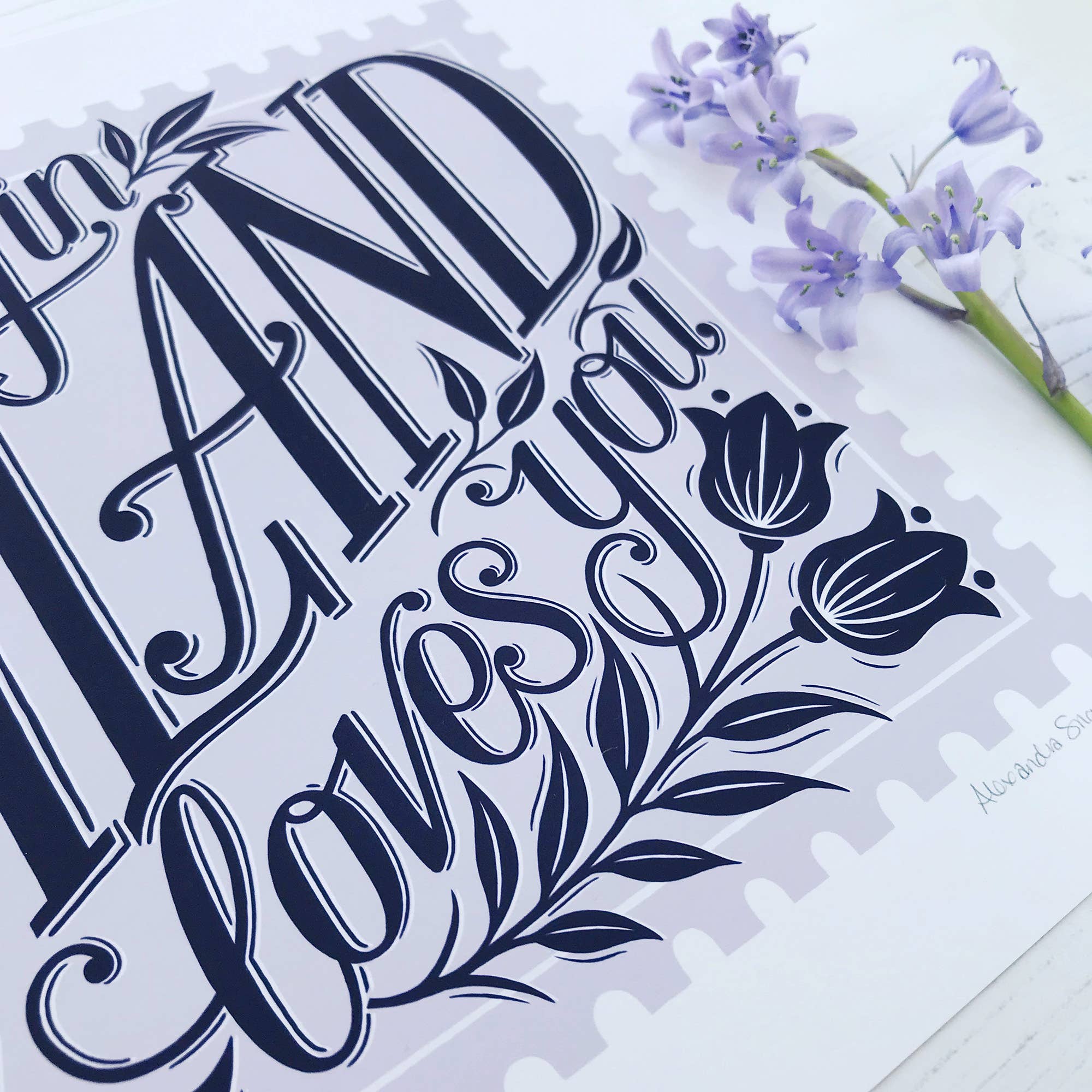 Decorative card with floral design and text on a white background.