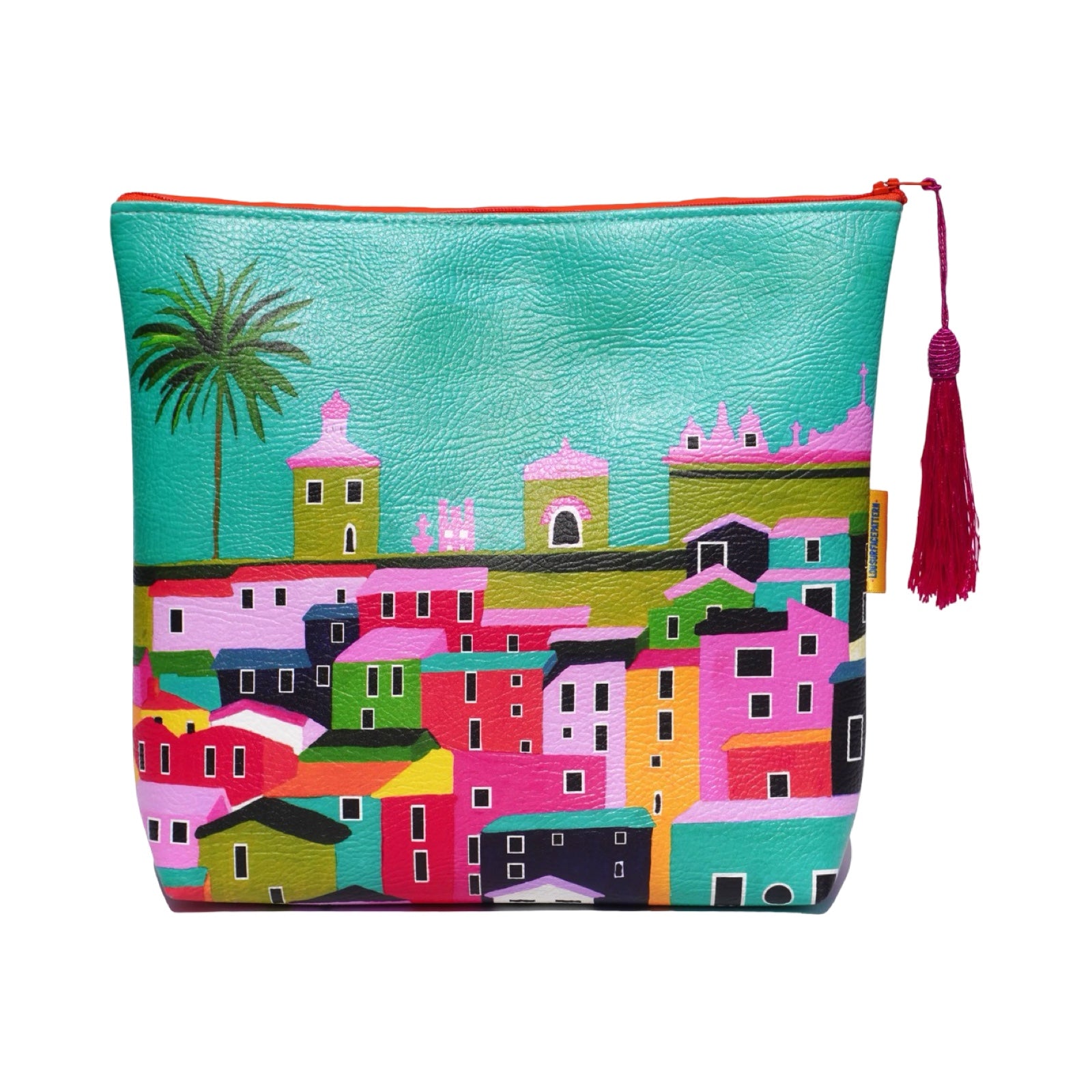 Vegan leather bag with a bright and colourful design of rooftops under a clear sky, and the bag is finished with a fabulous matching tassel on the end of the zip. 