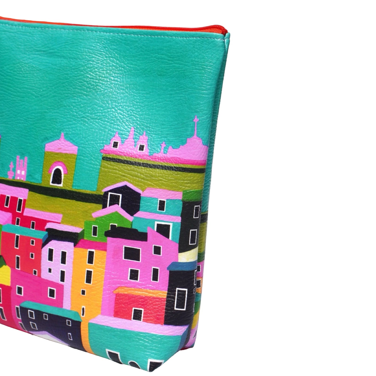 Vegan leather bag with a bright and colourful design of rooftops under a clear sky, and the bag is finished with a fabulous matching tassel on the end of the zip. 