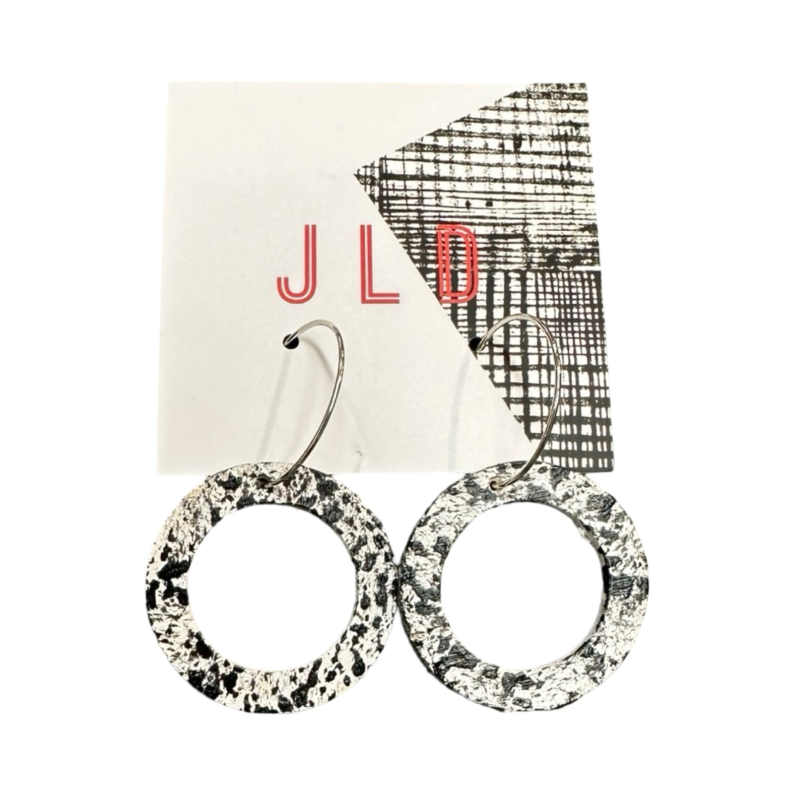 Pair of circular earrings with a textured pattern on a JLD branded card.