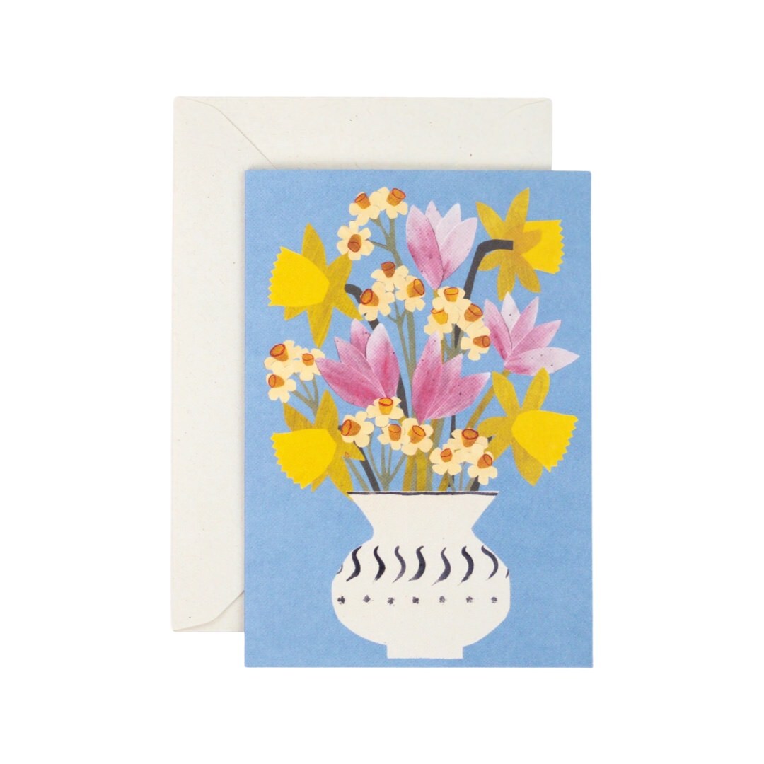 Floral card featuring an illustration of a bunch of pink, yellow and white spring flowers in a white vase against a lilac background