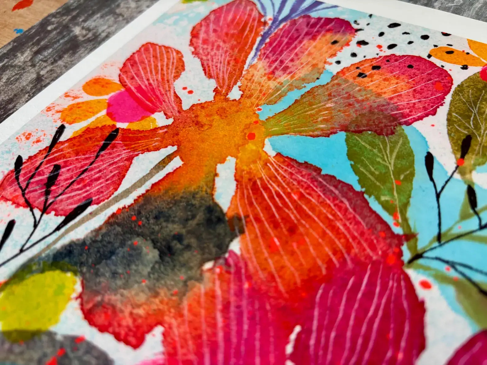 Colourful floral painting with vibrant red and orange flowers on a textured surface.