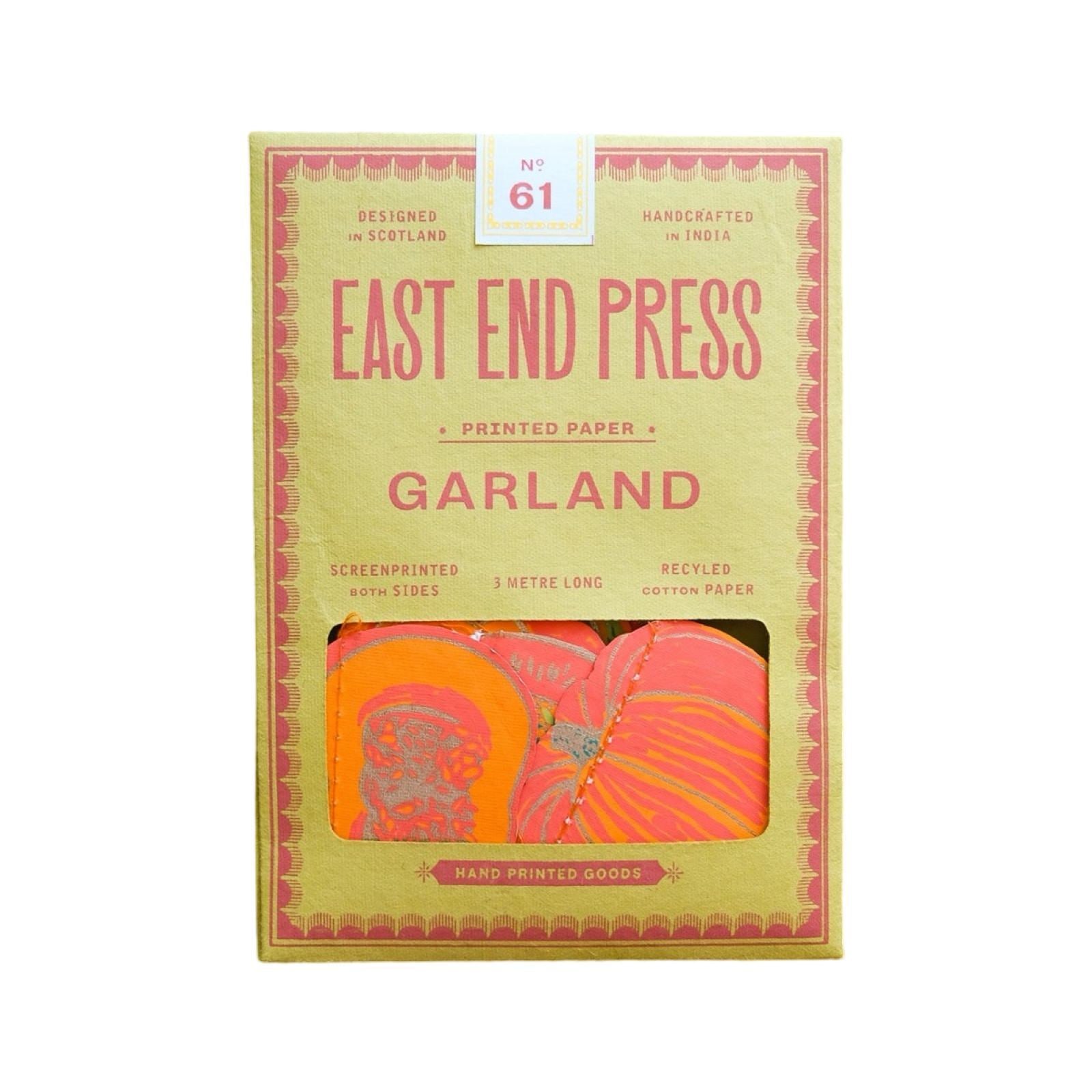 A yellow rectangular paper packet for squashes paper garland.