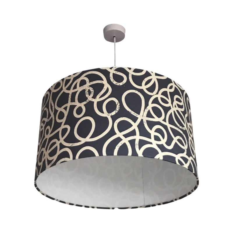Drum lampshade covered in denim canvas fabric with white squiggles