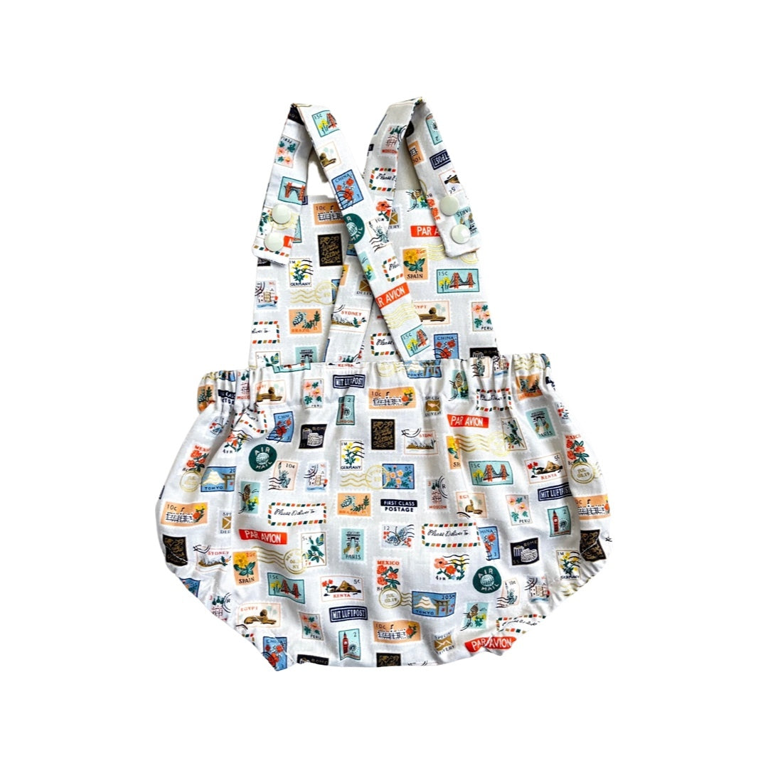 A short romper with a stone stamp fabric featuring stamps.