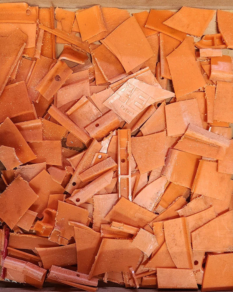 Collection of plastic tiles in various shapes and sizes.