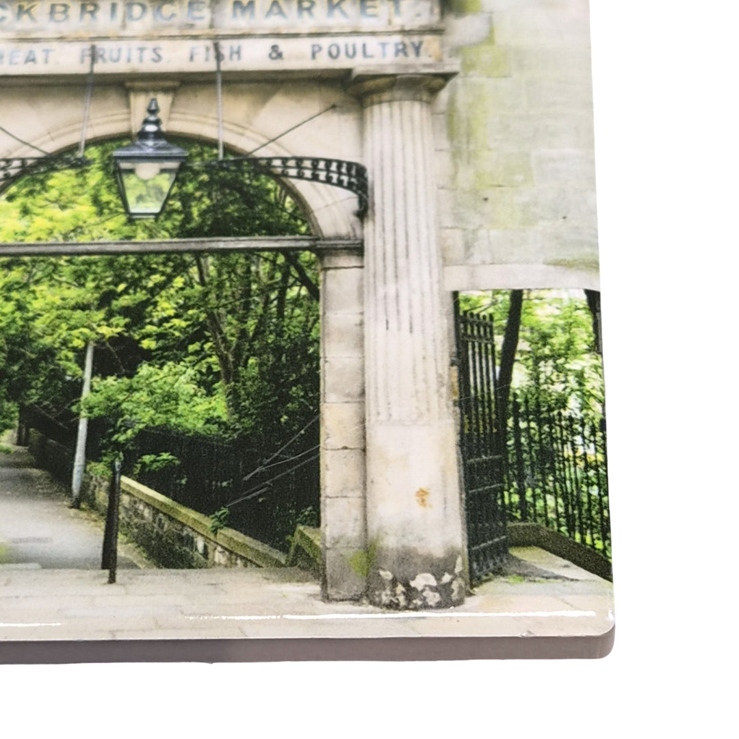 Stone archway on a ceramic coaster. 