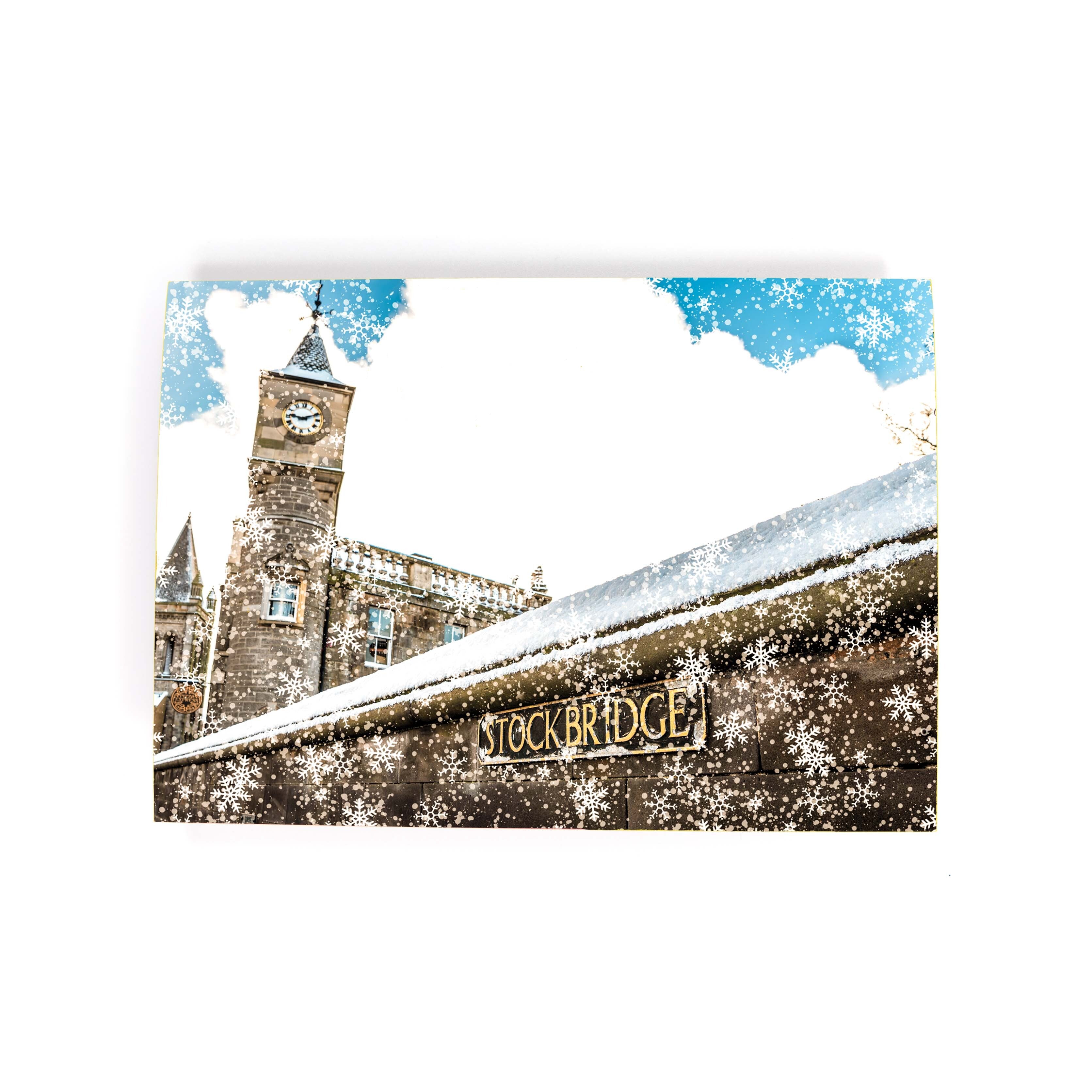 An image of Stockbridge with snow on a card. 