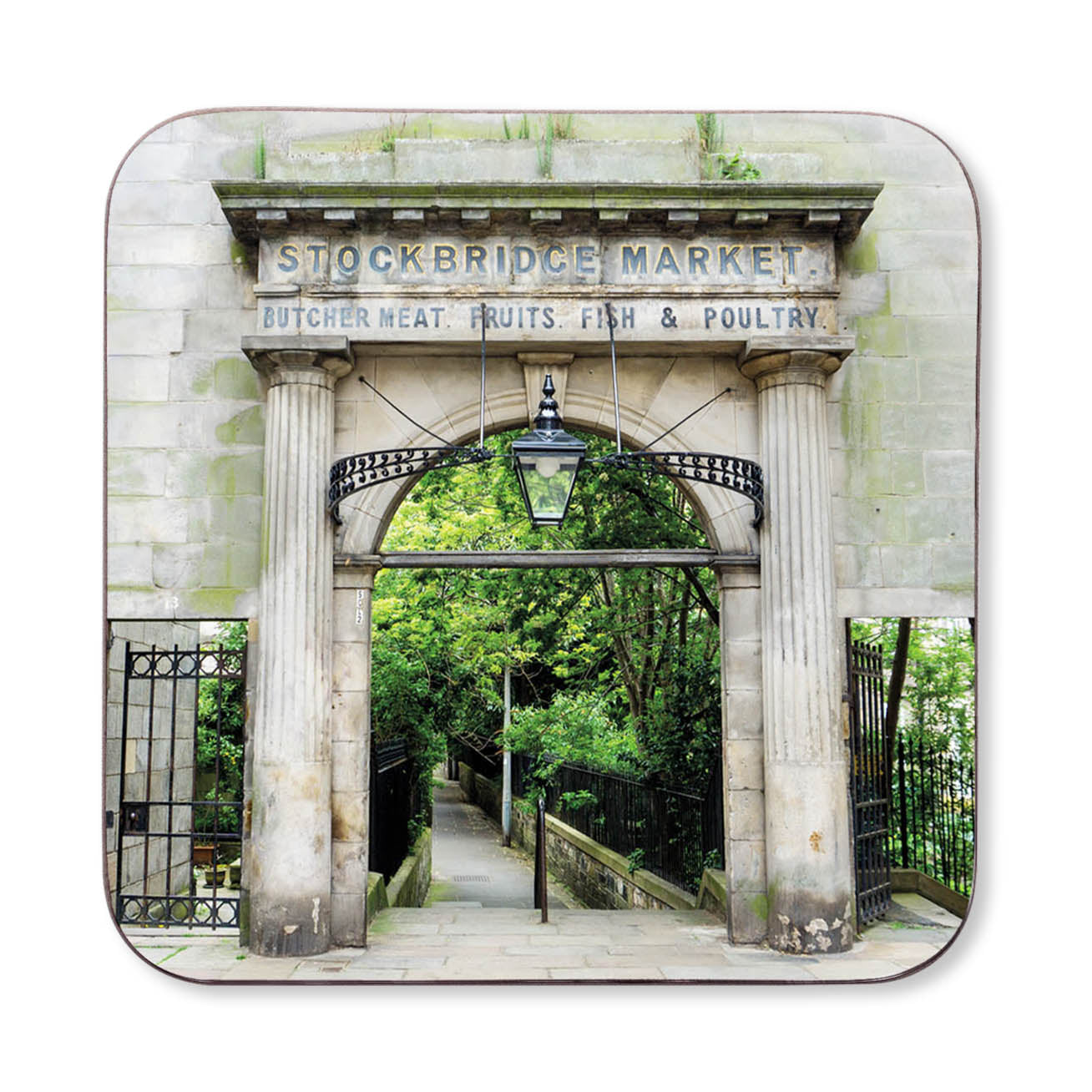 An image of the Stockbridge Market Arch on a wooden coaster.