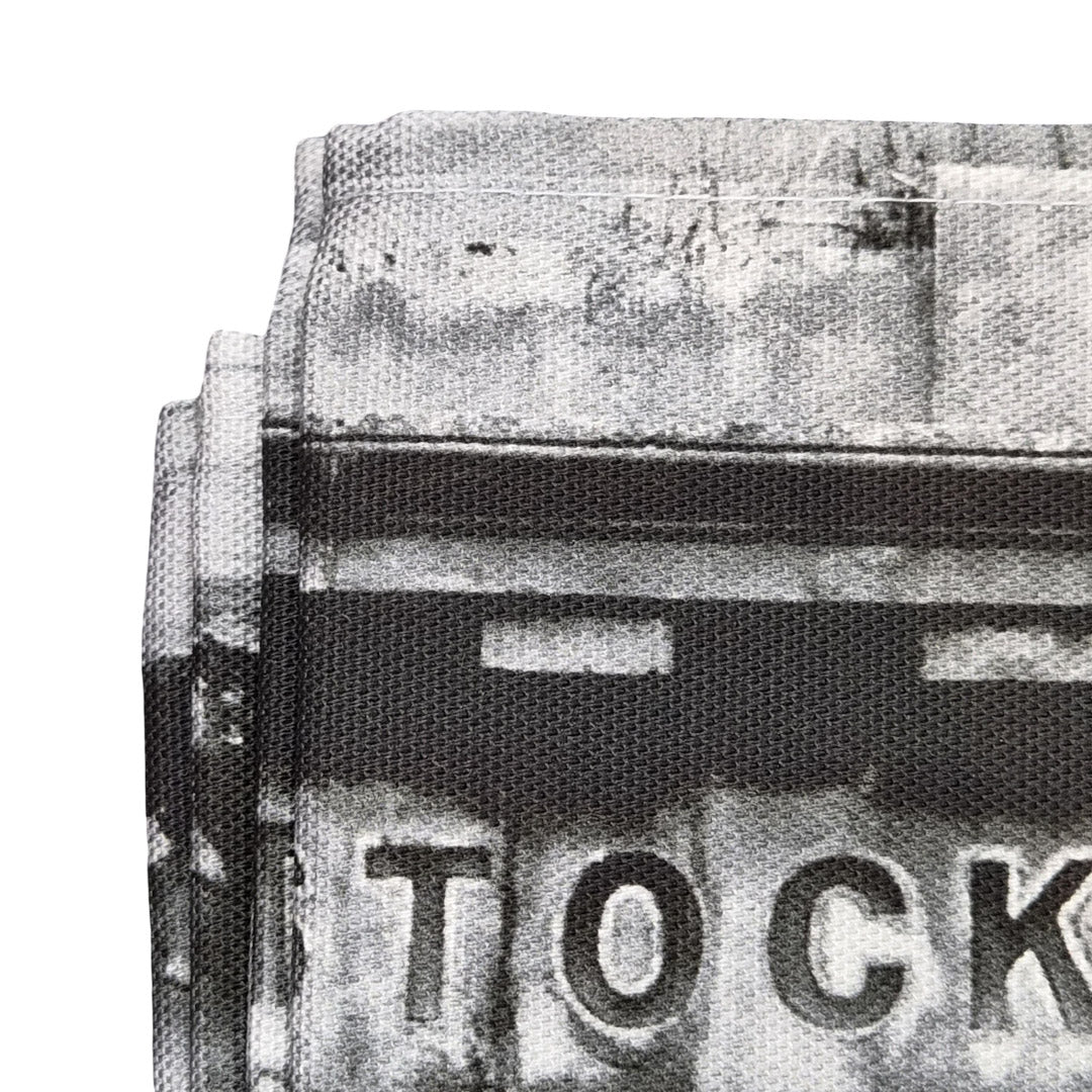 Close up of a tea towel featuring the Stockbridge Market arch. 