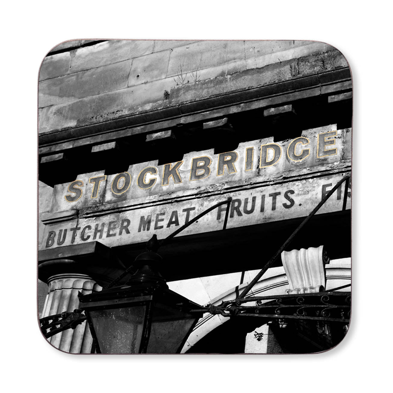 A close up of the Stockbridge market sign on a coaster. 