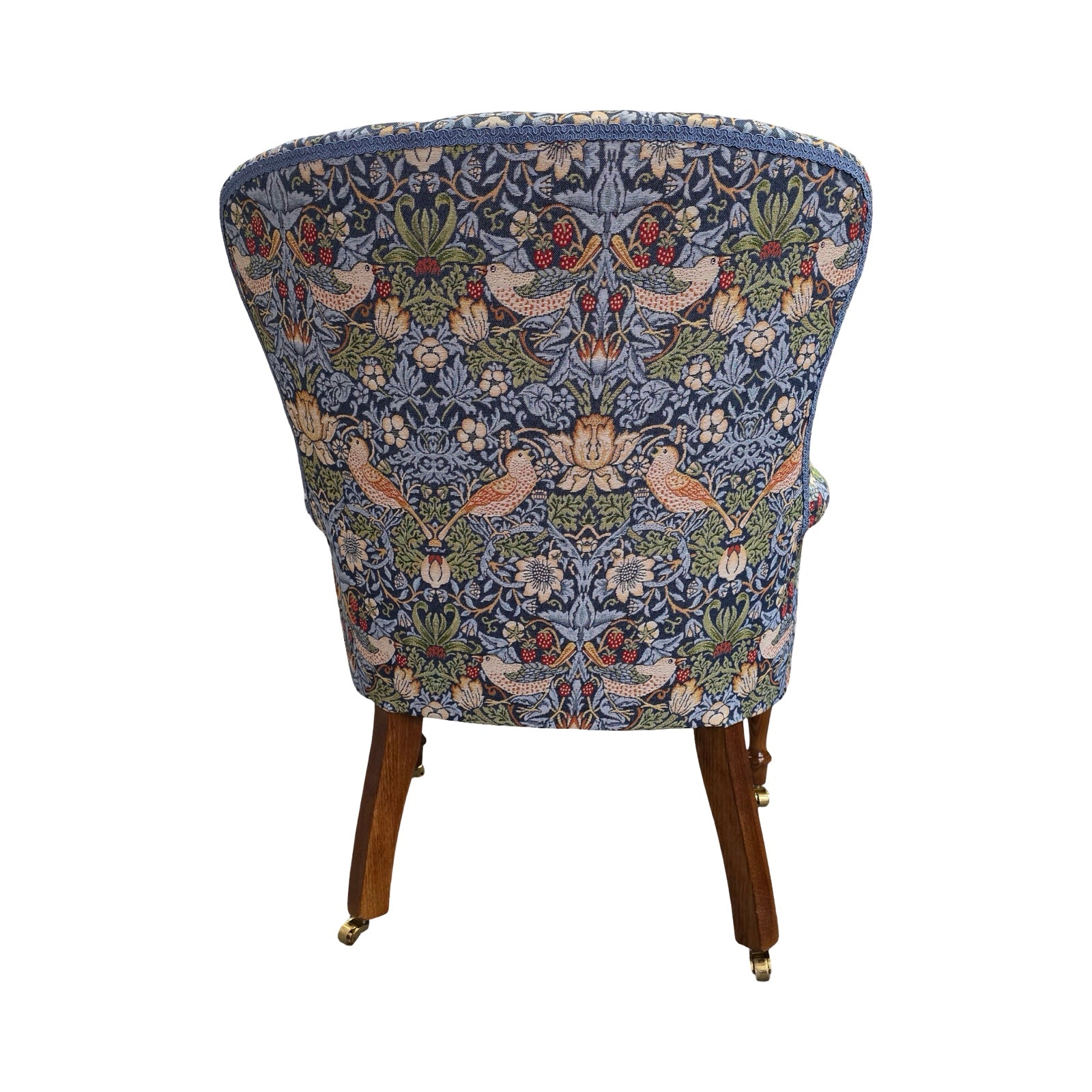 Chair with floral patterned fabric on a white background.