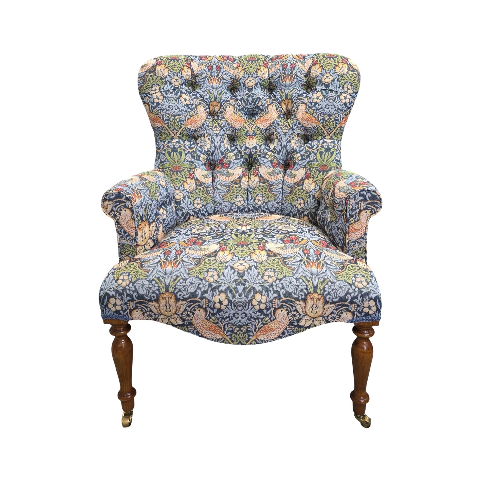 Decorative armchair with floral and bird pattern on a white background.