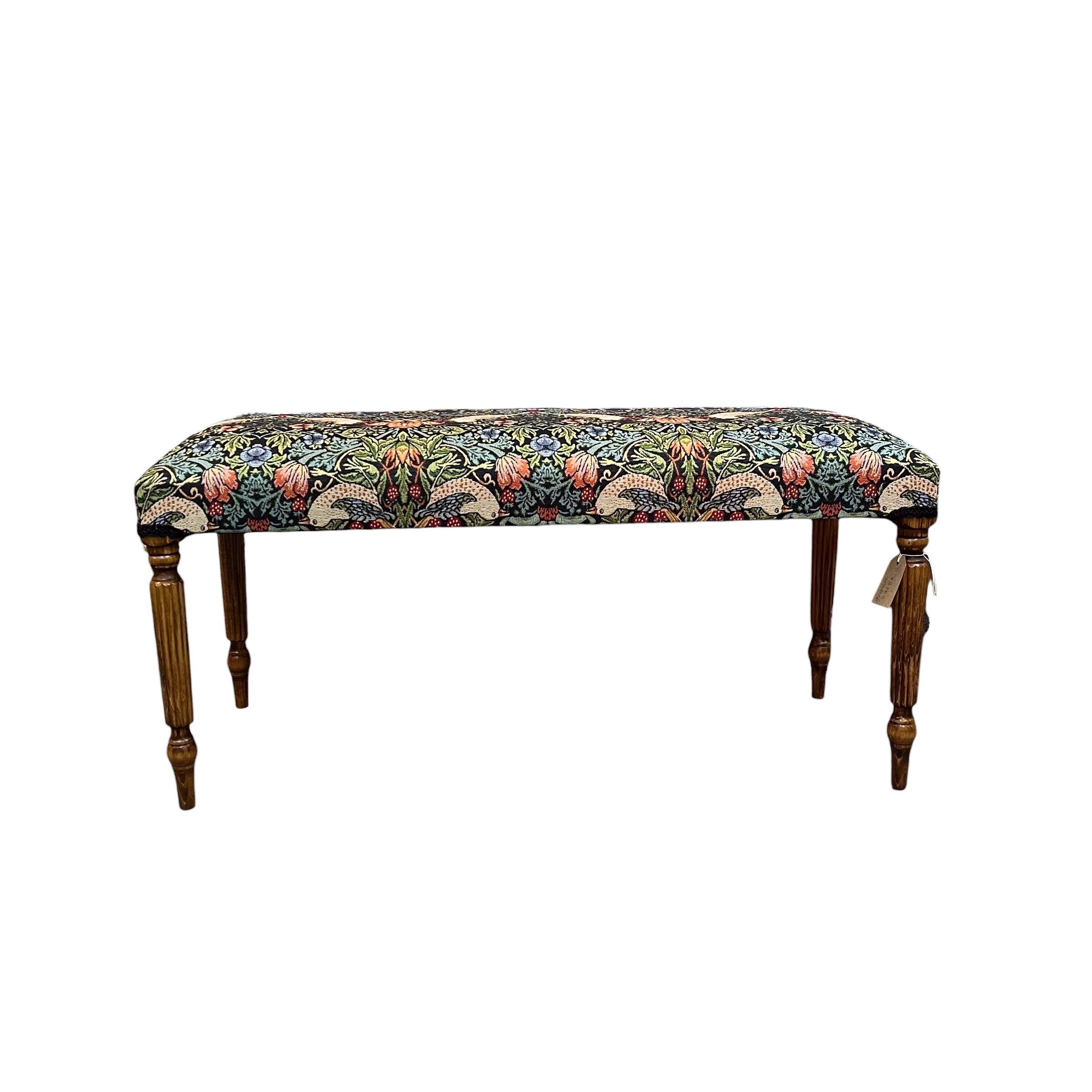 A beautiful hand crafted occasional bench, perfect for any lounge, conservatory or bedroom. &nbsp;Covered in a beautiful Strawberry Thief cotton in darker tones embroidery style fabric with mahogany stained legs.