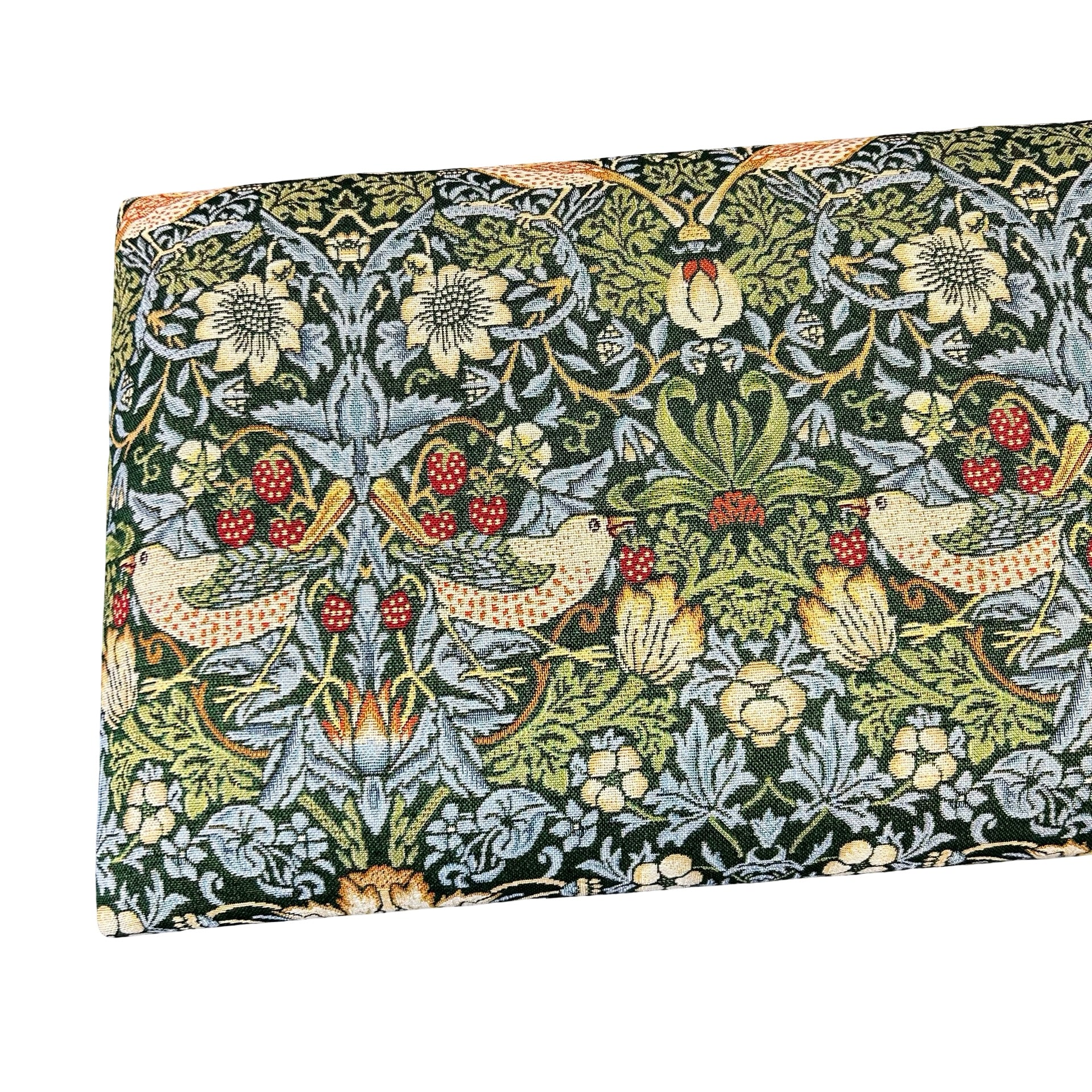 Close up of the top of a handcrafted occasional bench with mahogany legs and a green Strawberry Thief cotton embroidery style fabric cover.
