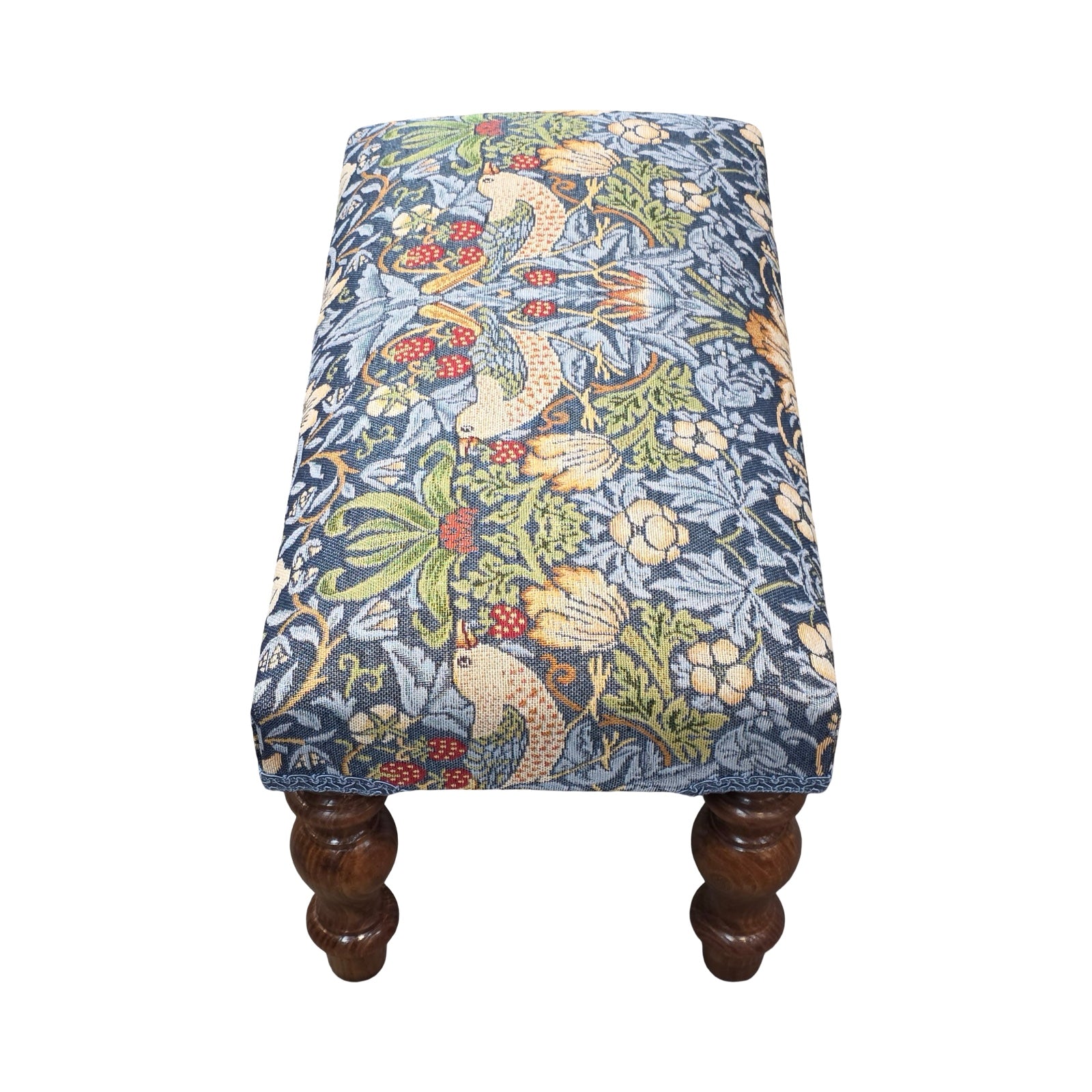 Stool with floral patterned fabric cover on a white background.