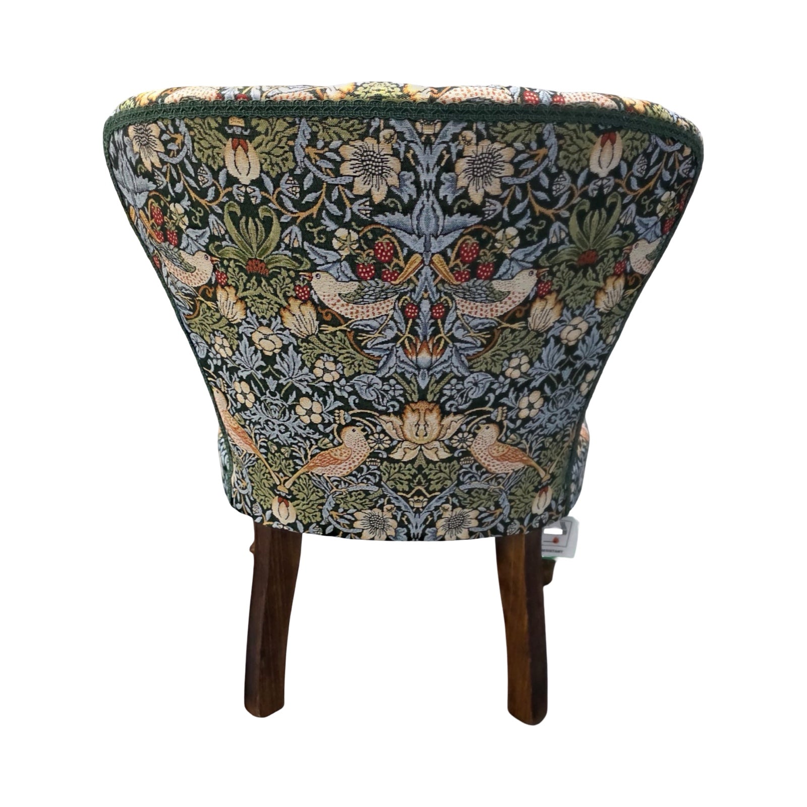 Decorative chair with floral and bird pattern on a white background.