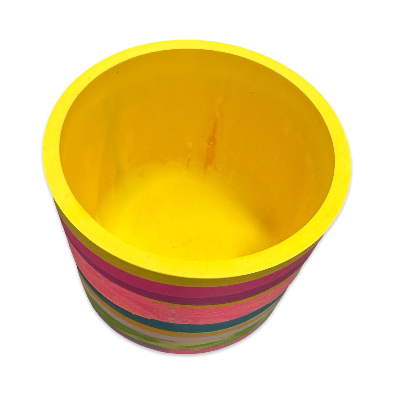 Colorful striped planter with a yellow inside on a white background.
