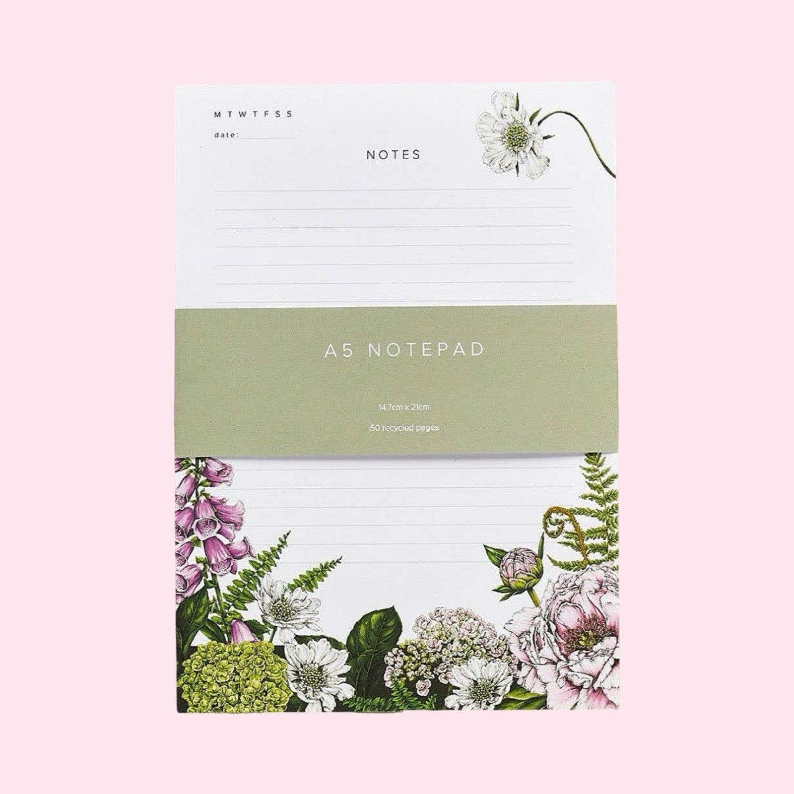 Notepad with floral design on a pink background.