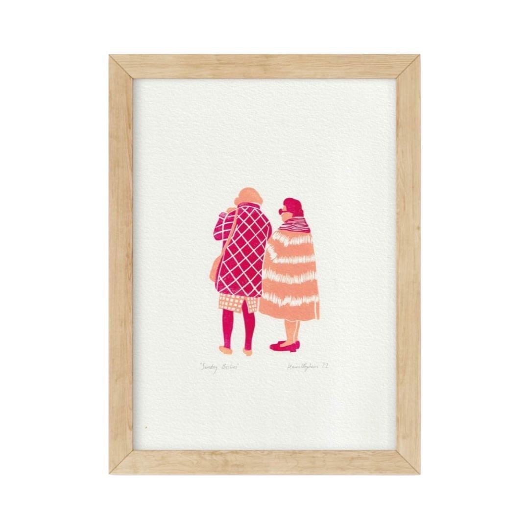 A4 print featuring two cartoon characters, one in pink and the other in blue, walking and talking on the phone, framed.