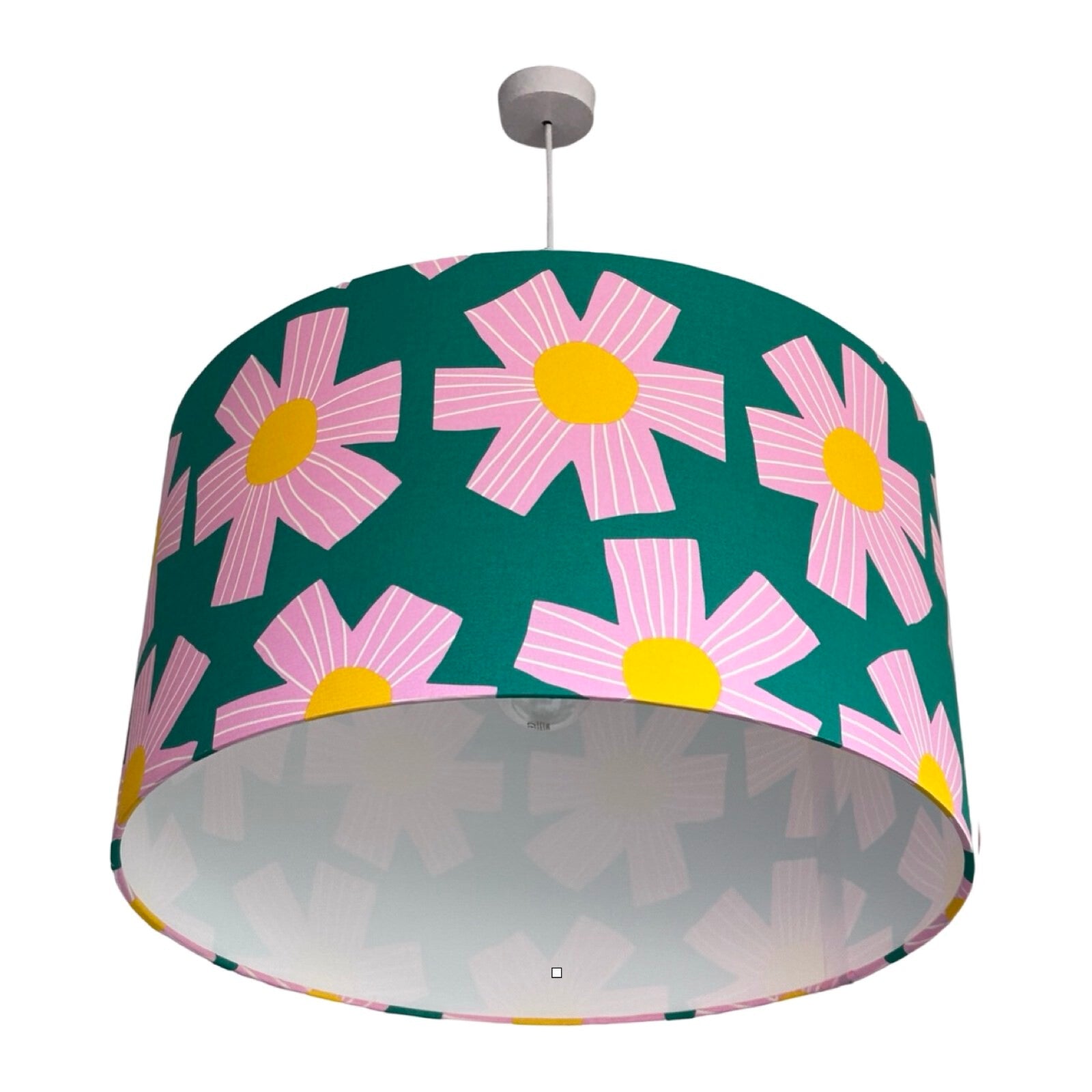 drum lampshade covered in green cotton fabric with giant pink flowers