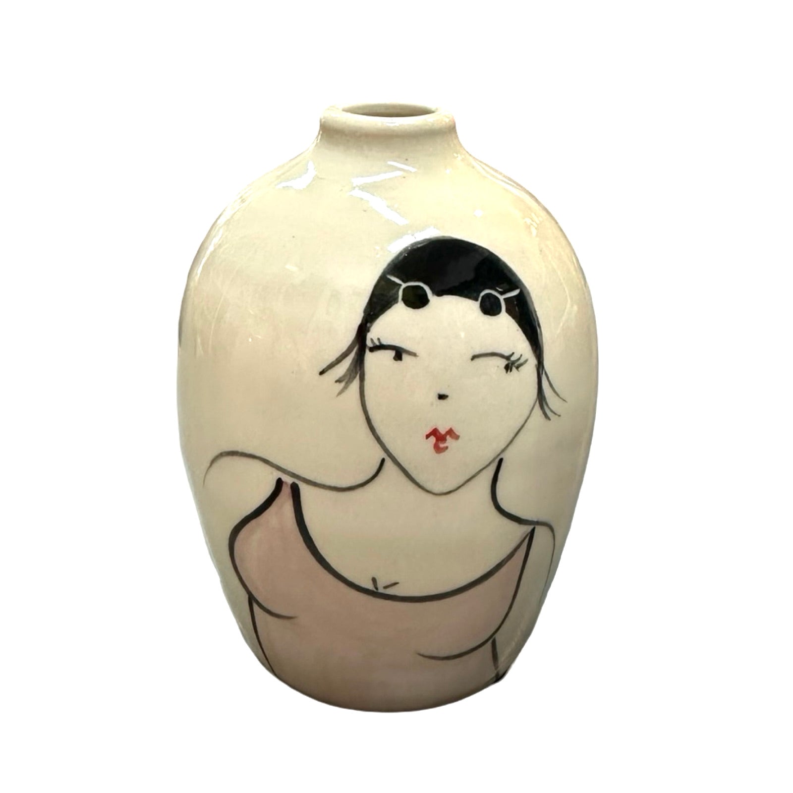 A cream coloured ceramic bud vase with a female wild swimmer wearings a dusky pink swimsuit and a black swim cap.
