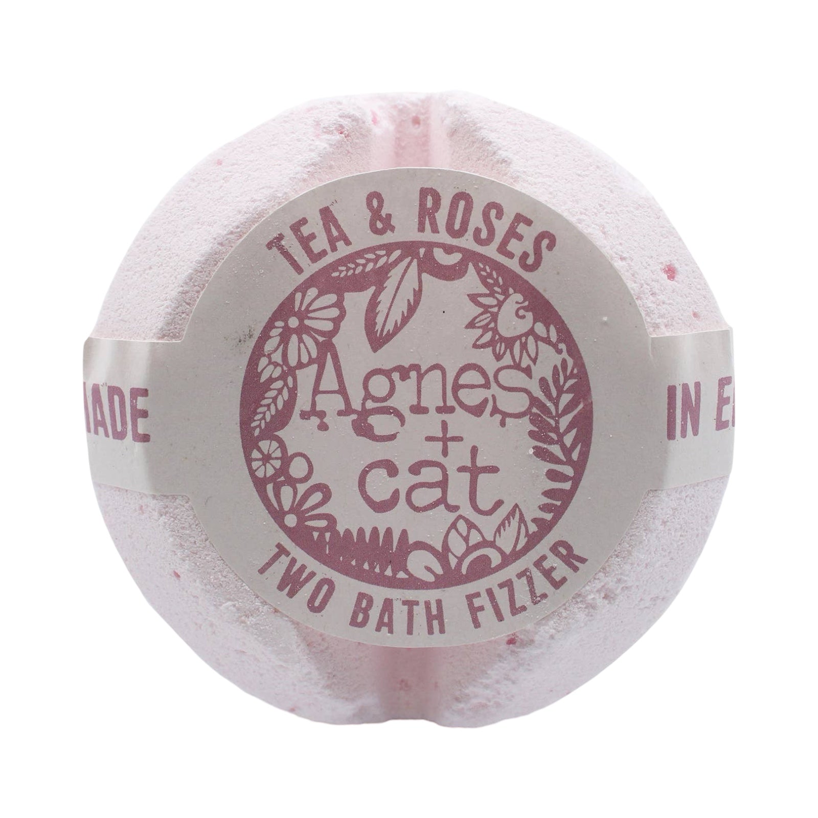 A circular shaped white tea and roses scented bath fizzer