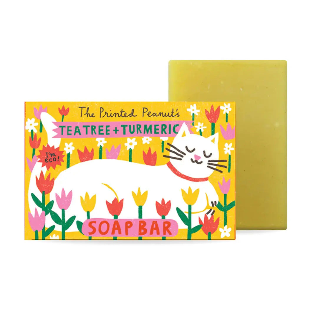 Soap bar with a colorful label featuring a cat and flowers on a white background.