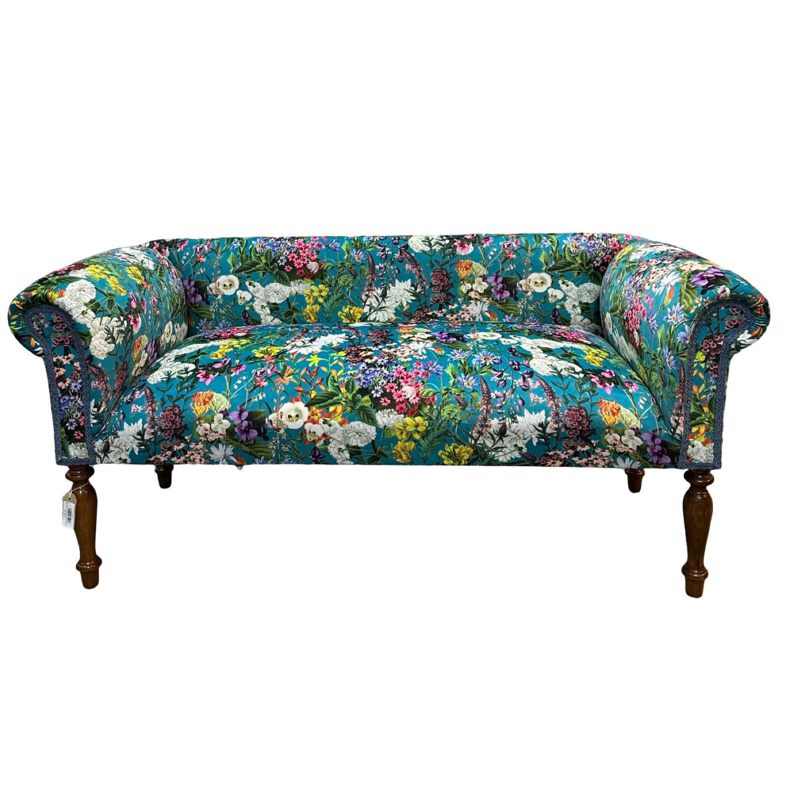 Floral patterned sofa on a white background.