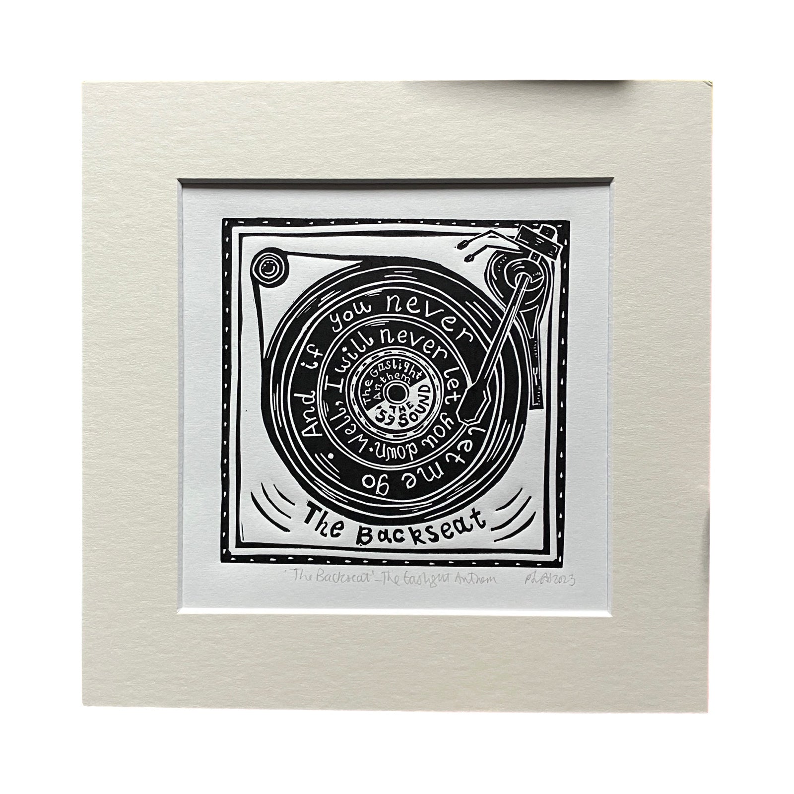 This black and white linocut print features a record playing on a record player, with the lyrics 'and if you never let me go, well, I will never let you down'.