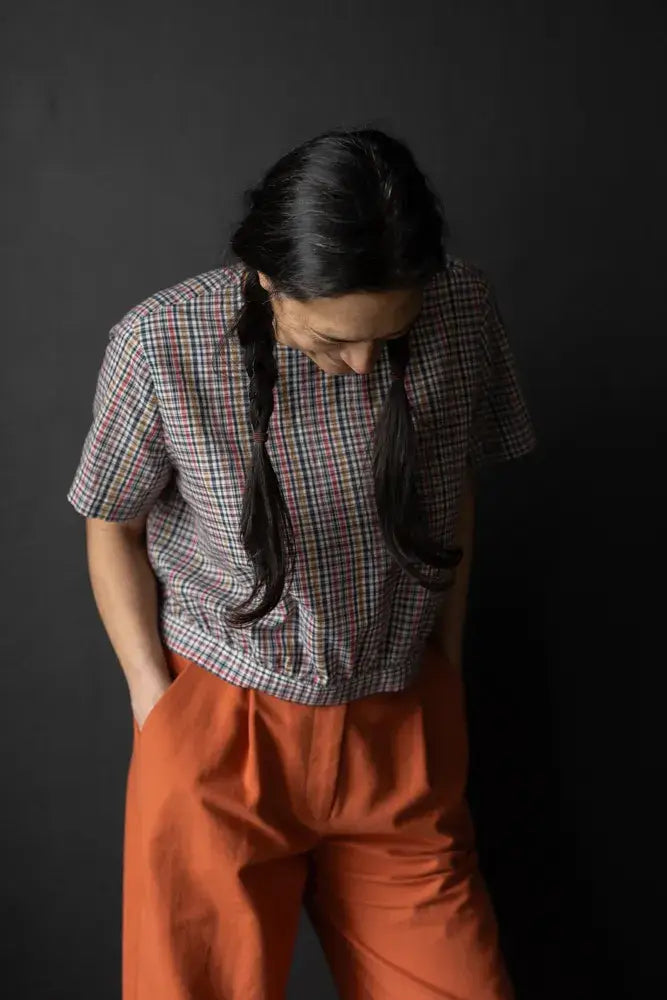 Sewing pattern for a feminine blouse, with back buttons, that gently gathers into a waistband.