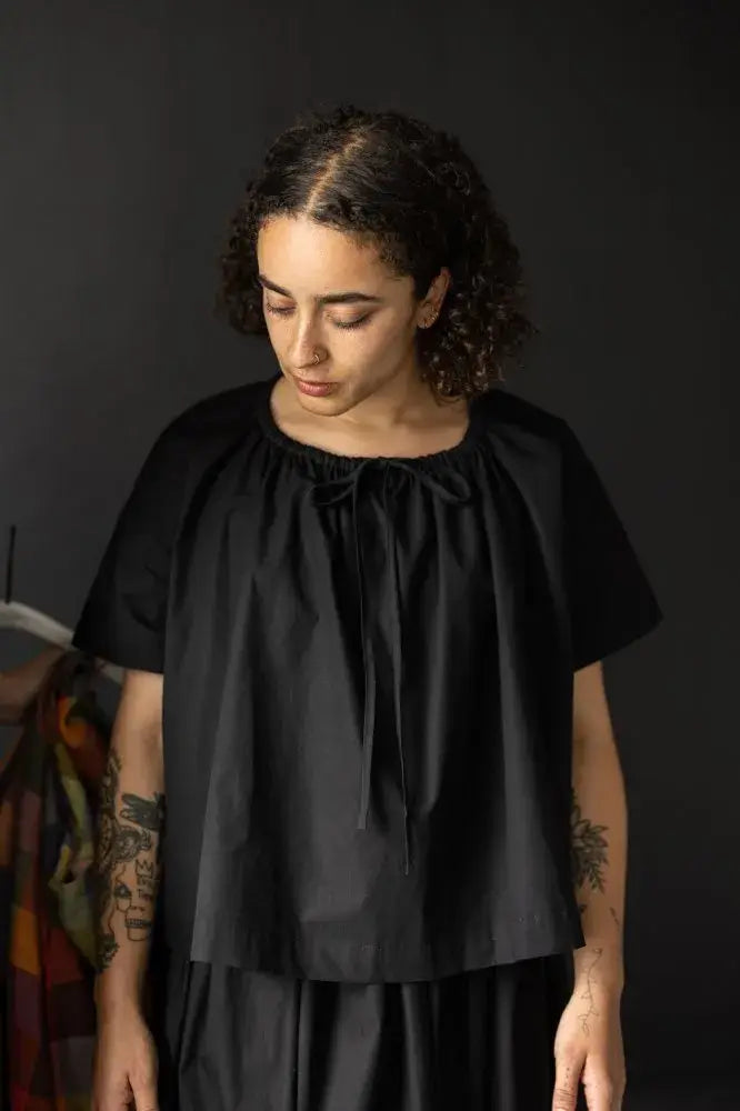 Sewing pattern for a T-shaped top or dress with a gathered drawstring neckline that can be adjusted to sit at your desired height; the pattern can be made with or without sleeves.