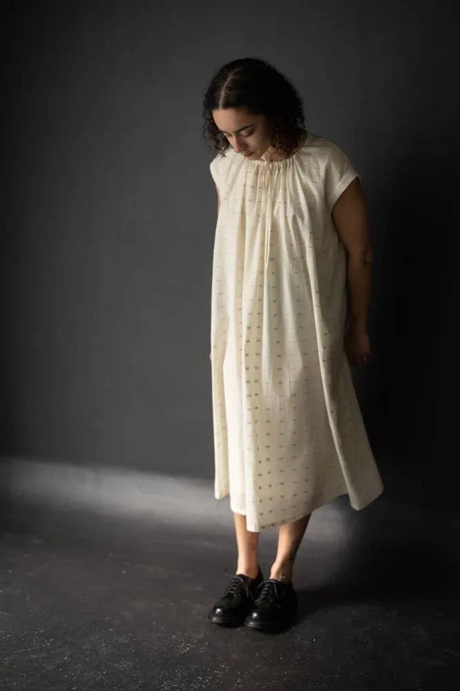 Sewing pattern for a T-shaped top or dress with a gathered drawstring neckline that can be adjusted to sit at your desired height; the pattern can be made with or without sleeves.