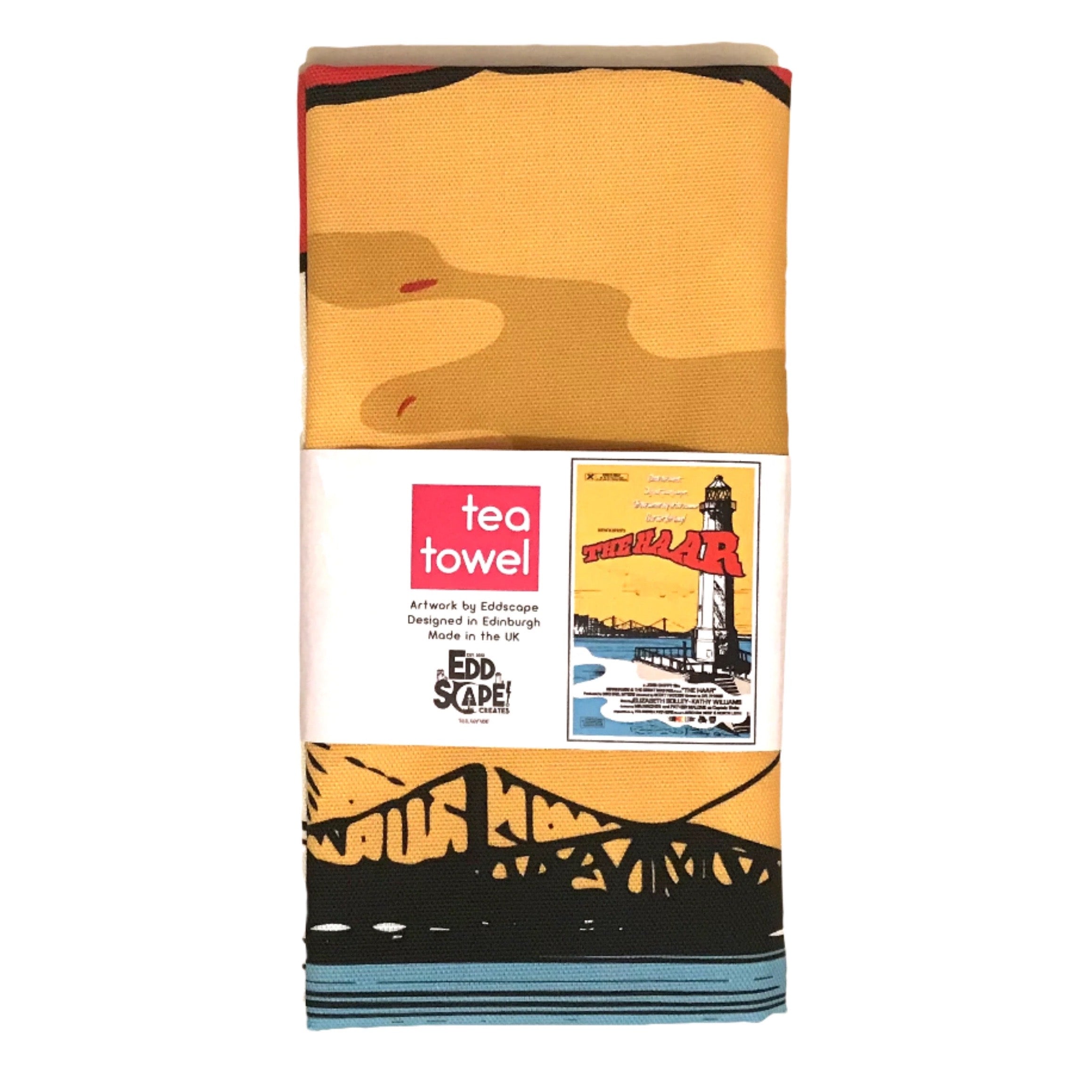 Tea towel featuring an illustration of Newhaven Lighthouse in Edinburgh with the 3 Forth Bridges in the background, packaged.