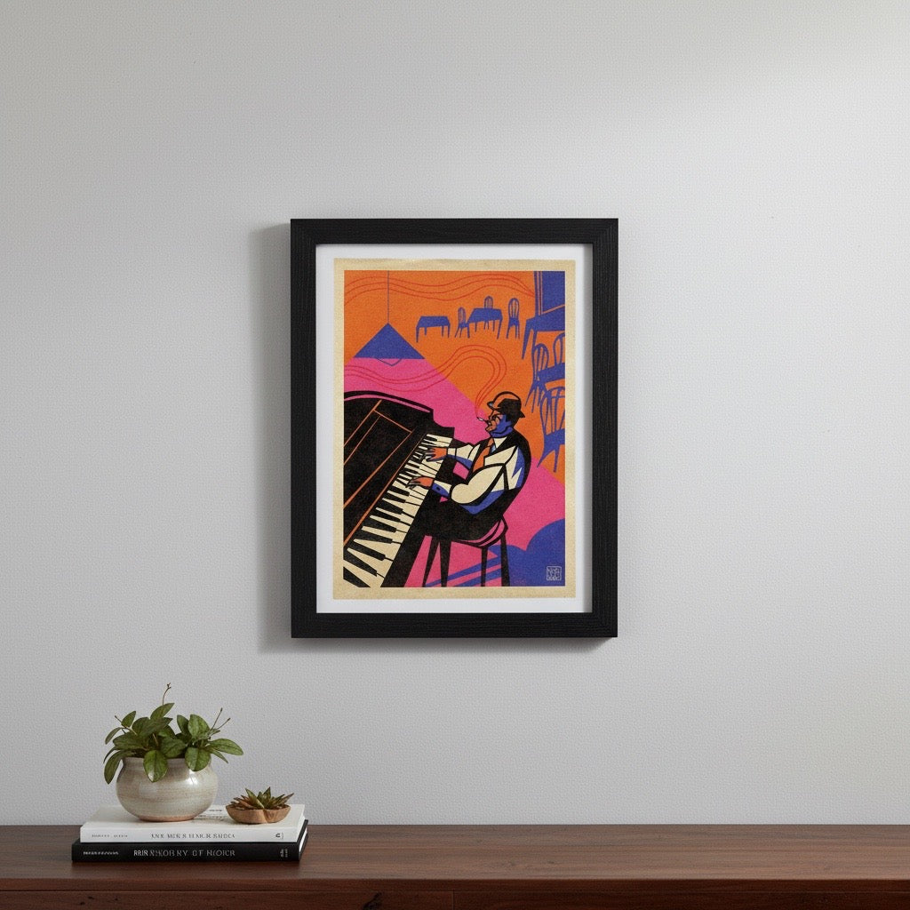 A framed art print featuring a stylised illustration of a pianist, hanging on a light grey wall above a wooden shelf with a small potted plant and a book.