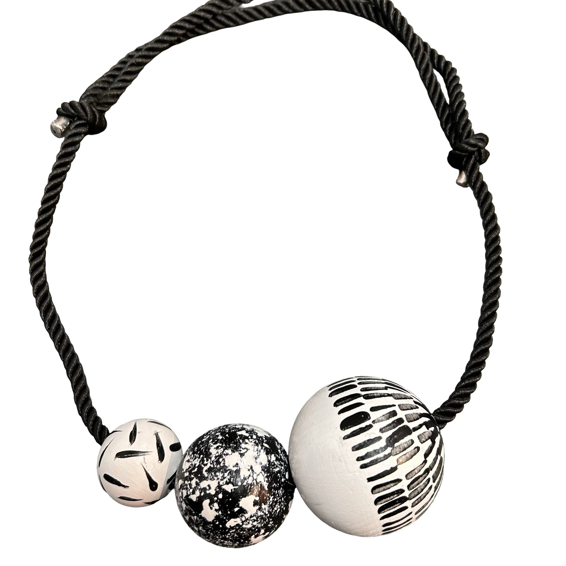 Bracelet with three beads on a white background.