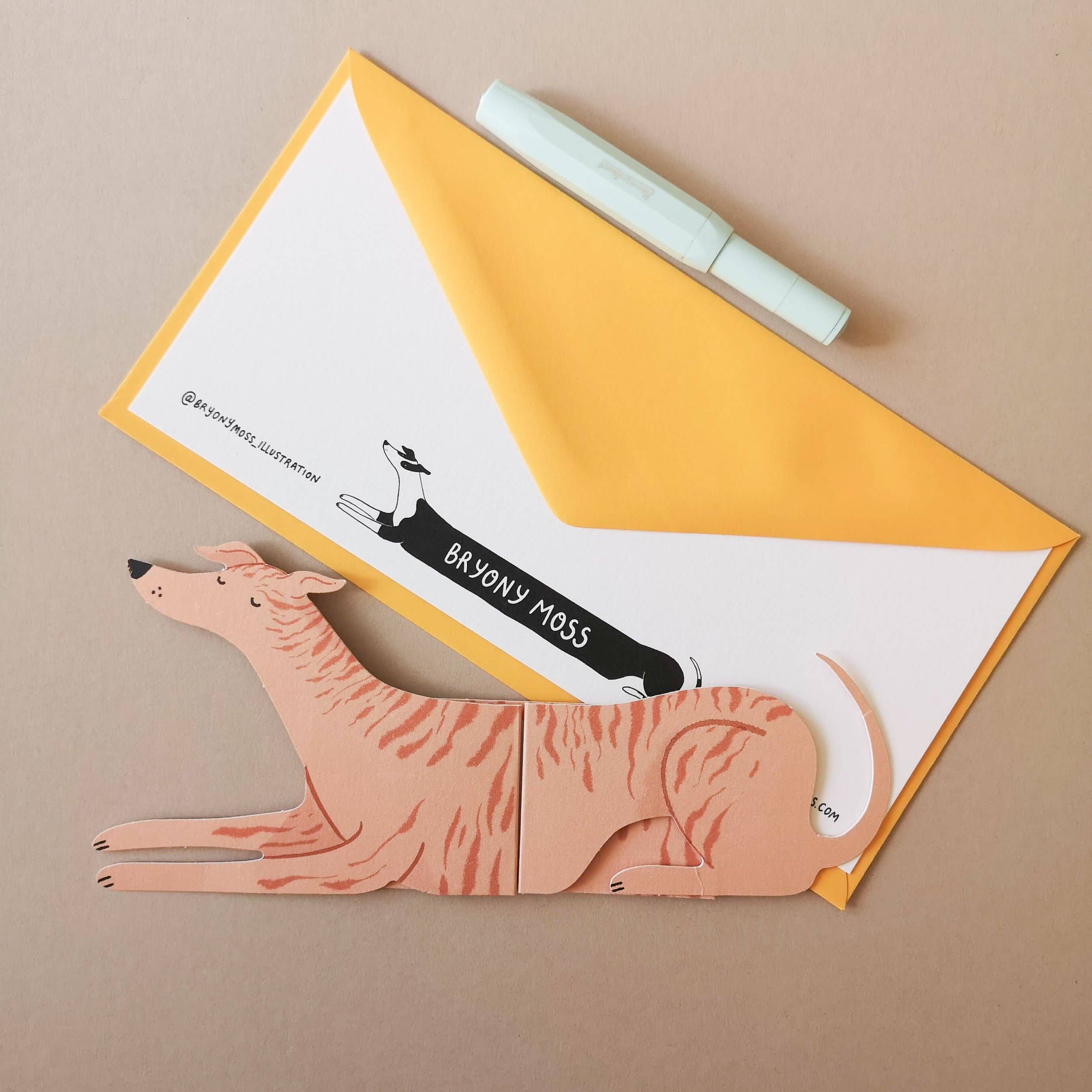 Card with a dog illustration and a yellow envelope on a beige background.