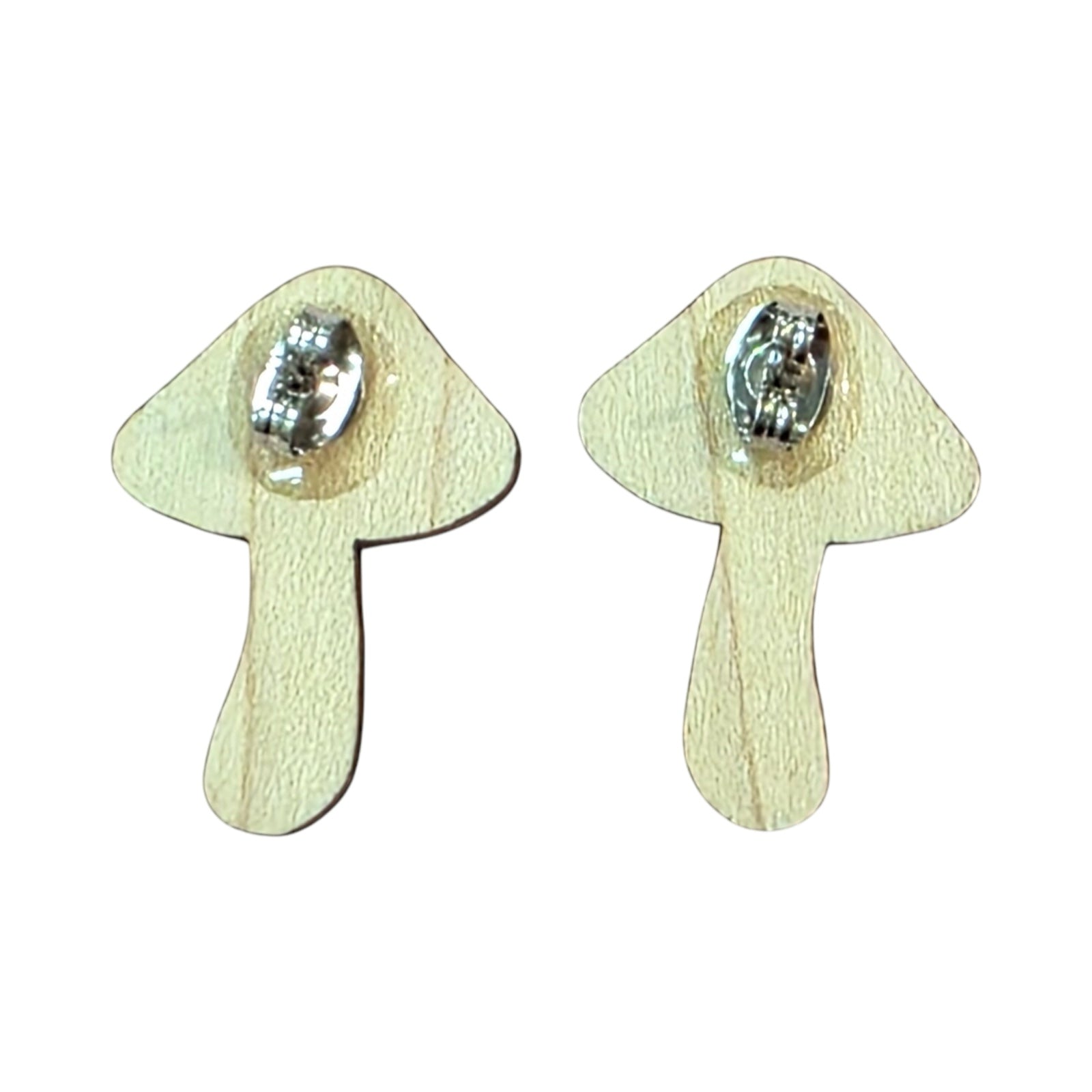 The back of a pair of wooden toadstool stud earrings showing silver earring posts.