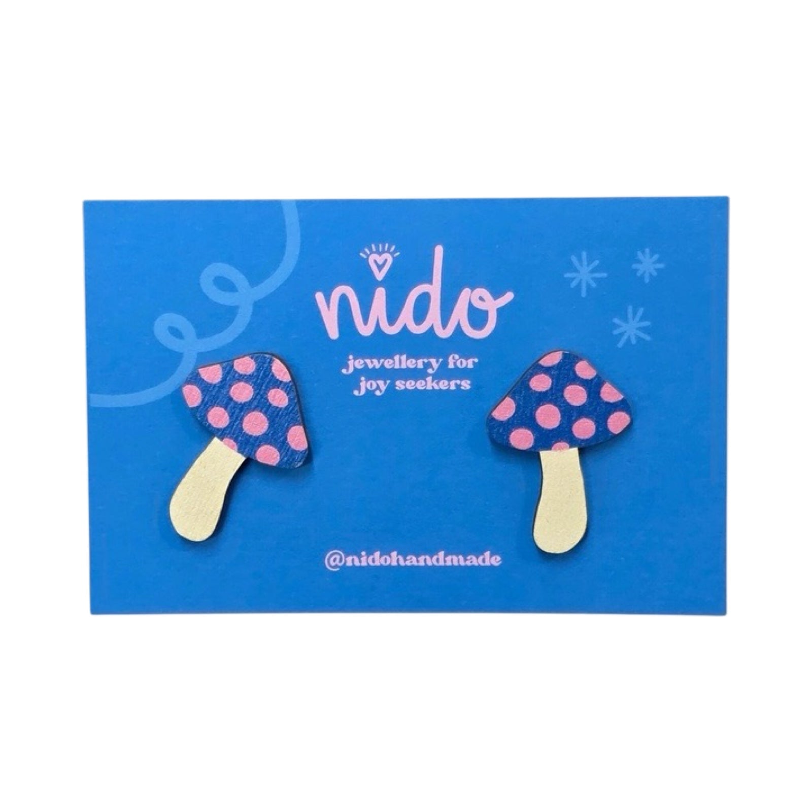 Toadstool stud earrings with blue and pink spotty tops on a blue backing card.