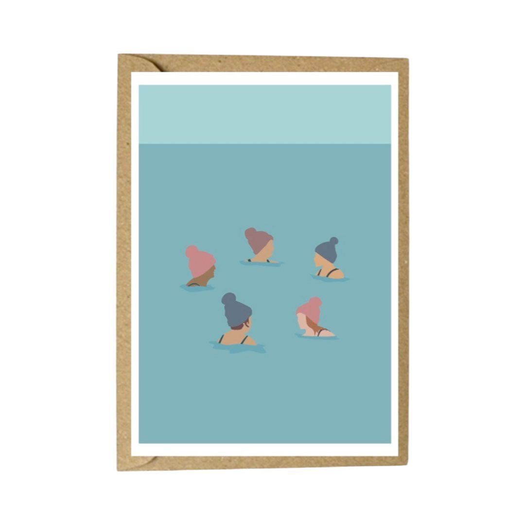 Art card featuring a group of wild swimmers in their woolly pom-pom hats up to their shoulders in the sea.