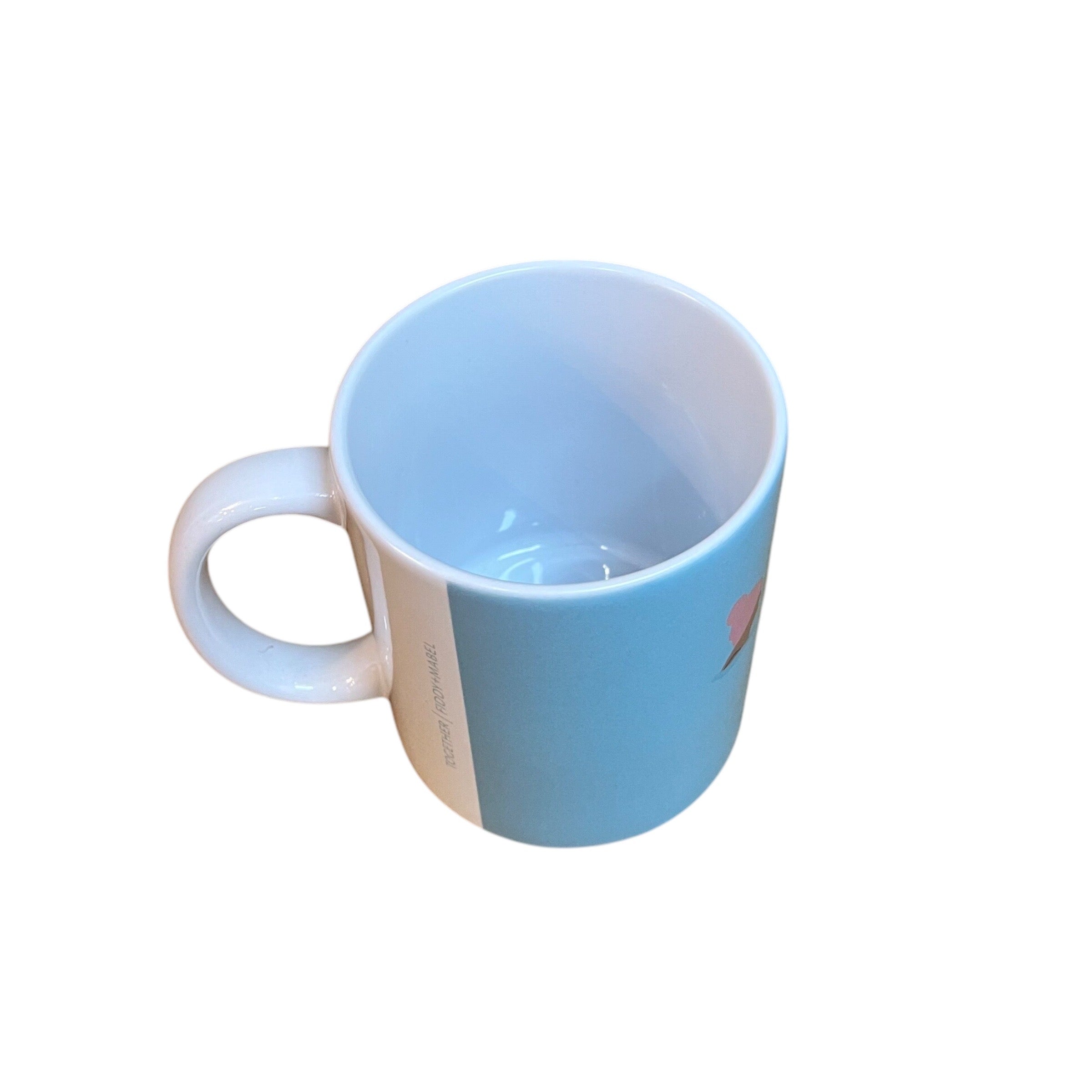 Mug featuring a group of wild swimmers in their woolly pom-pom hats up to their shoulders in the sea. This mug holds 10oz and is dishwasher safe.