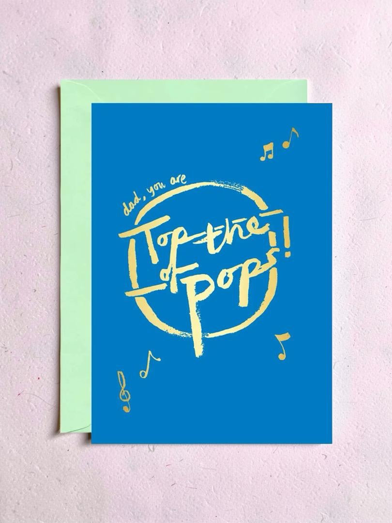 Blue card with yellow text 'Top of the Pops!' on a light background.