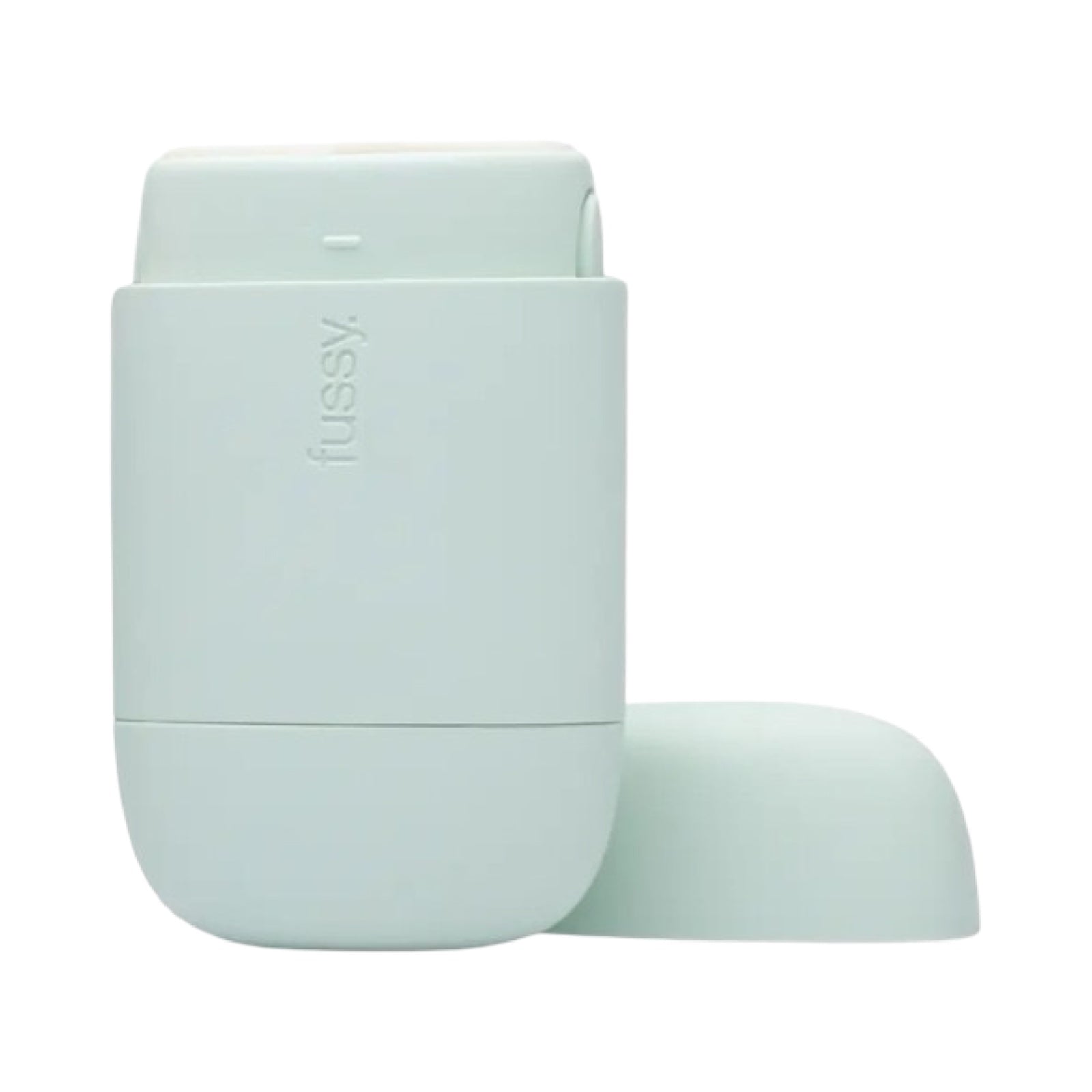 A mint refillable deodorant case with the lid off.