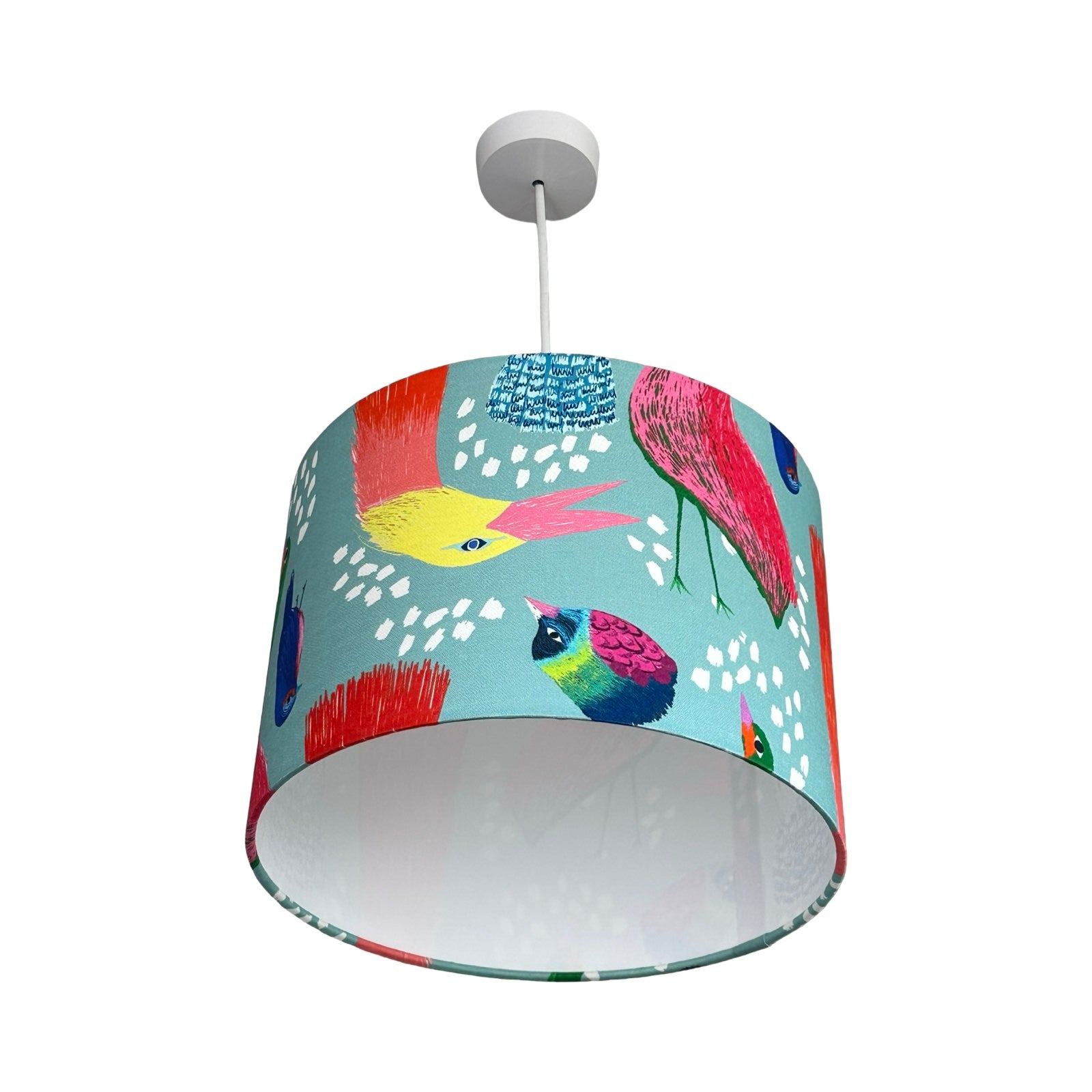 Colourful lampshade with bird design on a white background.