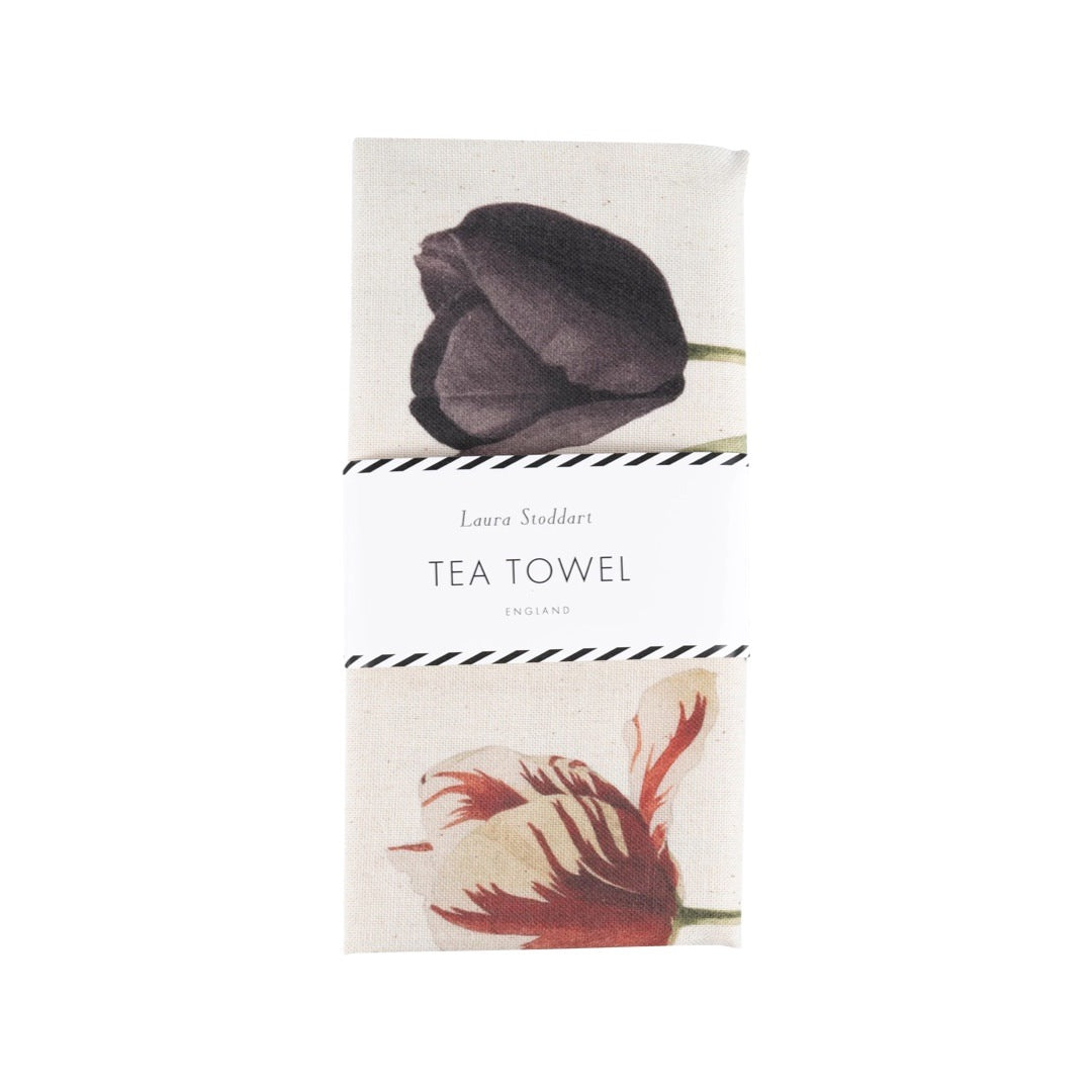 Gorgeous tulip tea towel featuring six multicoloured giant tulips being held by fabulously dressed men and women and edged in a blue dotted border.