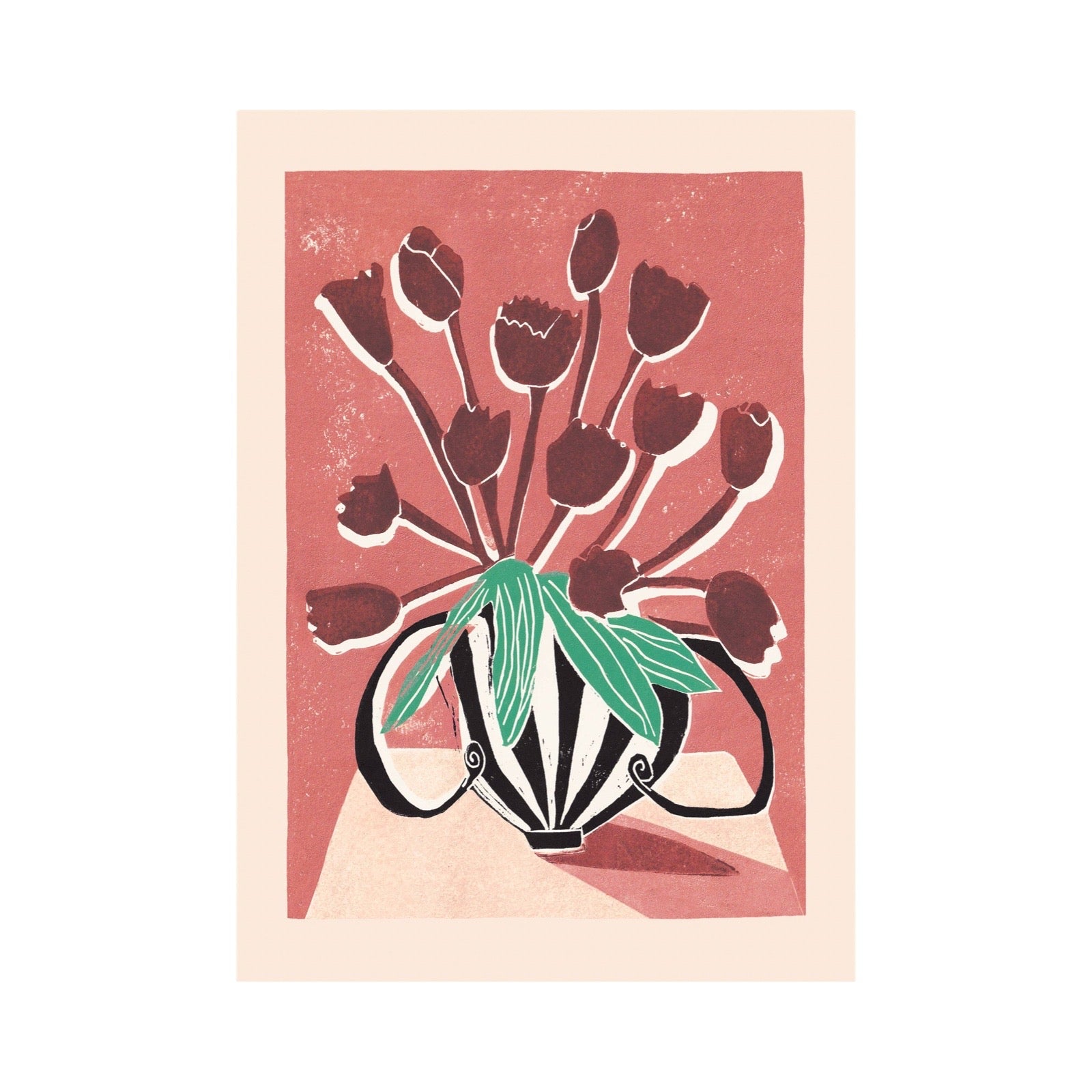 A minimalist art print featuring a vase with tulips, rendered in a linocut or woodcut style. The print has a muted pink background, dark red tulips with white highlights, and green leaves, framed by a wide cream border.