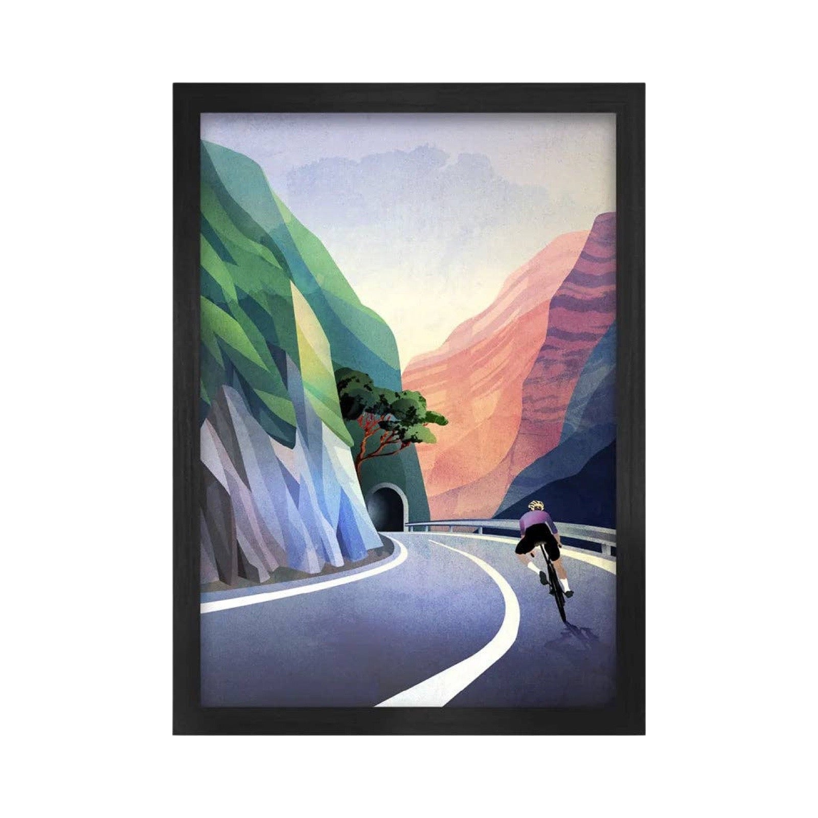 A framed art print depicting a cyclist riding along a winding mountain road, surrounded by stylized green and pink canyon walls under a soft sky, shown in a black frame against a white background.