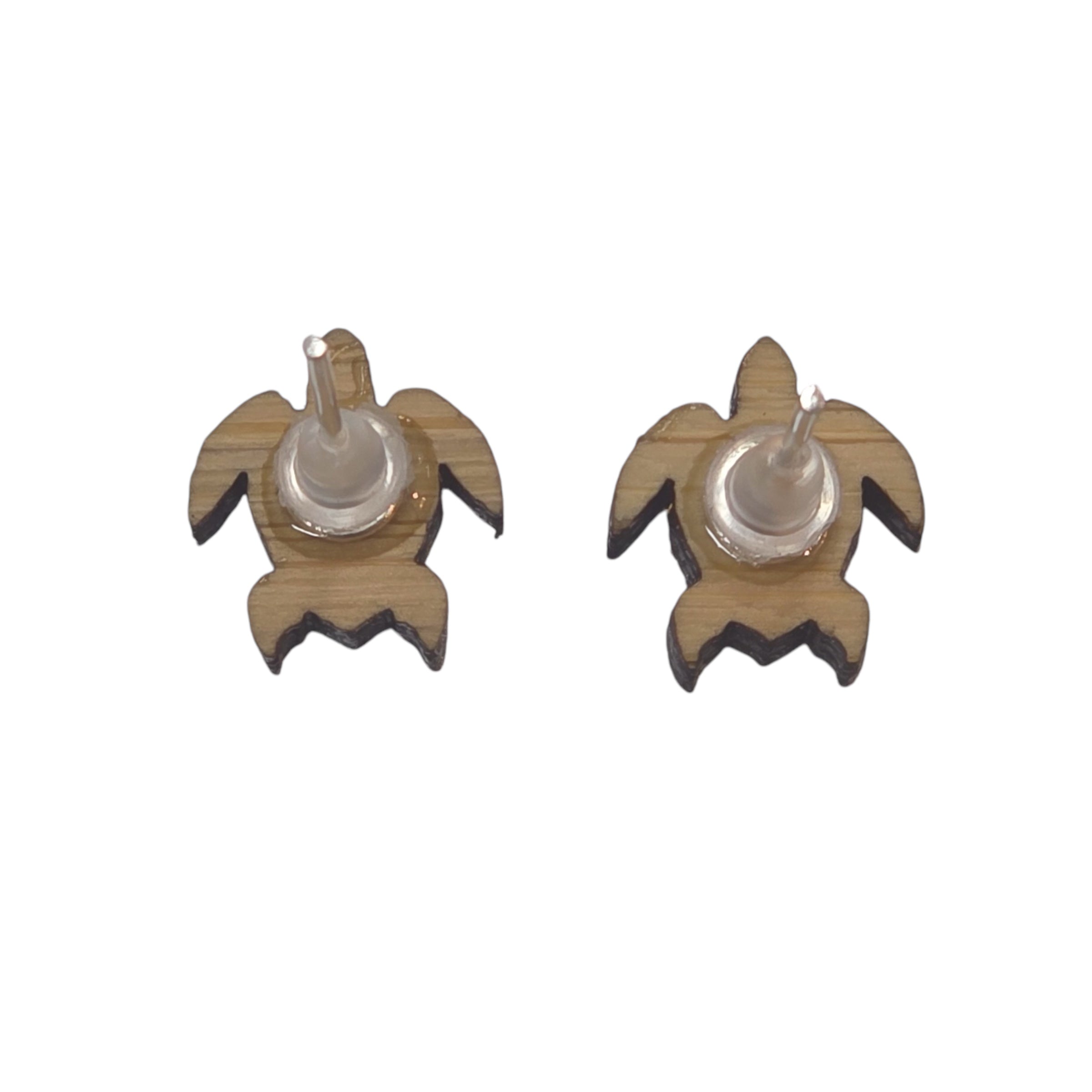 The back of two small wooden stud earrings shaped as turtles 